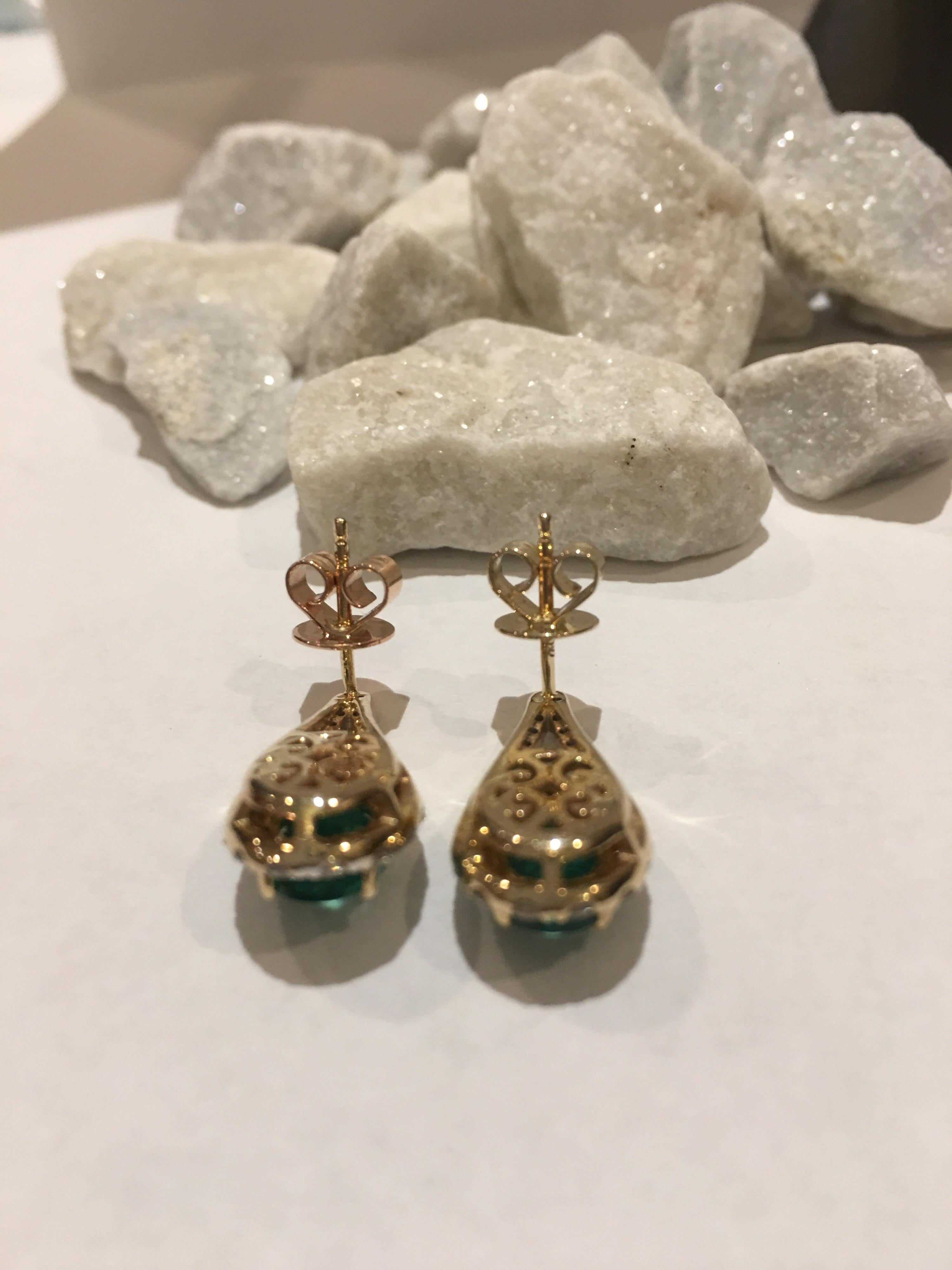 Oval Cut Emerald Diamond Earring set in 14 Karat Yellow Gold