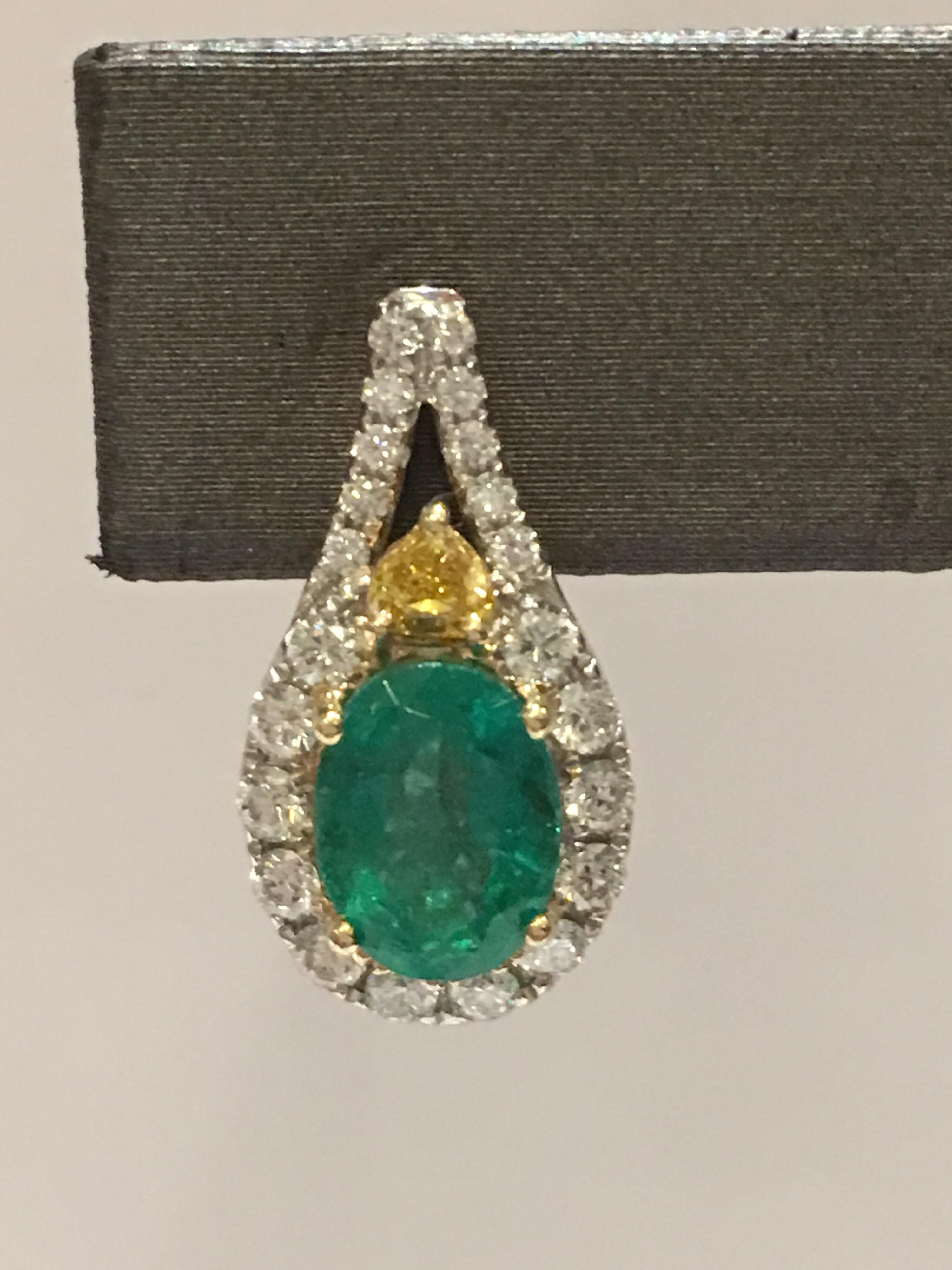 Women's Emerald Diamond Earring set in 14 Karat Yellow Gold