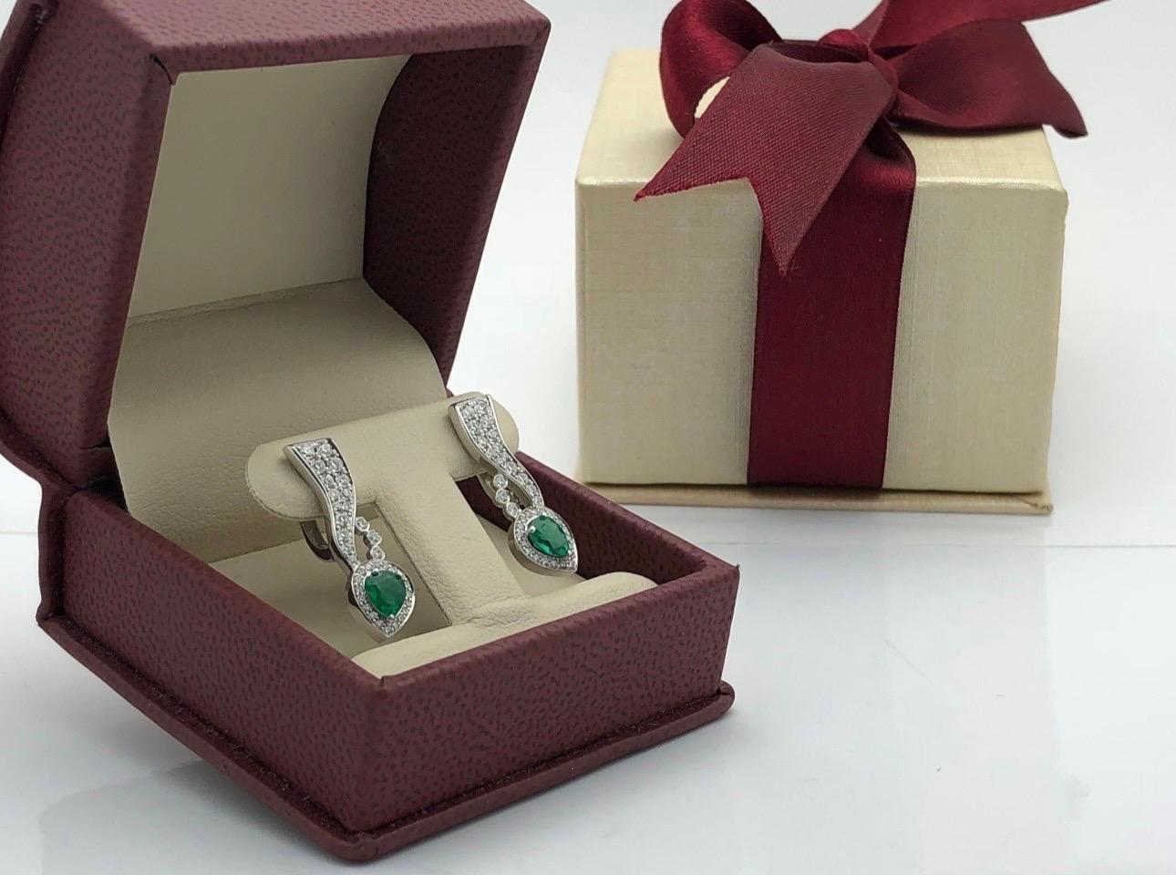 Stunning classical earrings made with matching pear shape emeralds from Colombia and fine diamonds and 18KT gold.
Diamonds are totaling 0.45ct, VS clarity and F color
Emeralds are 2.90ct, slightly blemished, Bluish Green in color
Earrings are about
