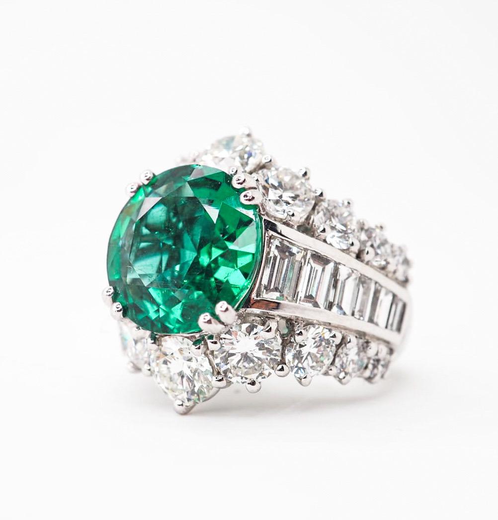 Your attention is presented to a unique object in the world of jewelry - a stunning ring crafted in 950 platinum with the highest quality Zambien emerald surrounded by the diamonds (D-E, VVS1 - VVS2).  

Breathtaking round mixed cut emerald with an