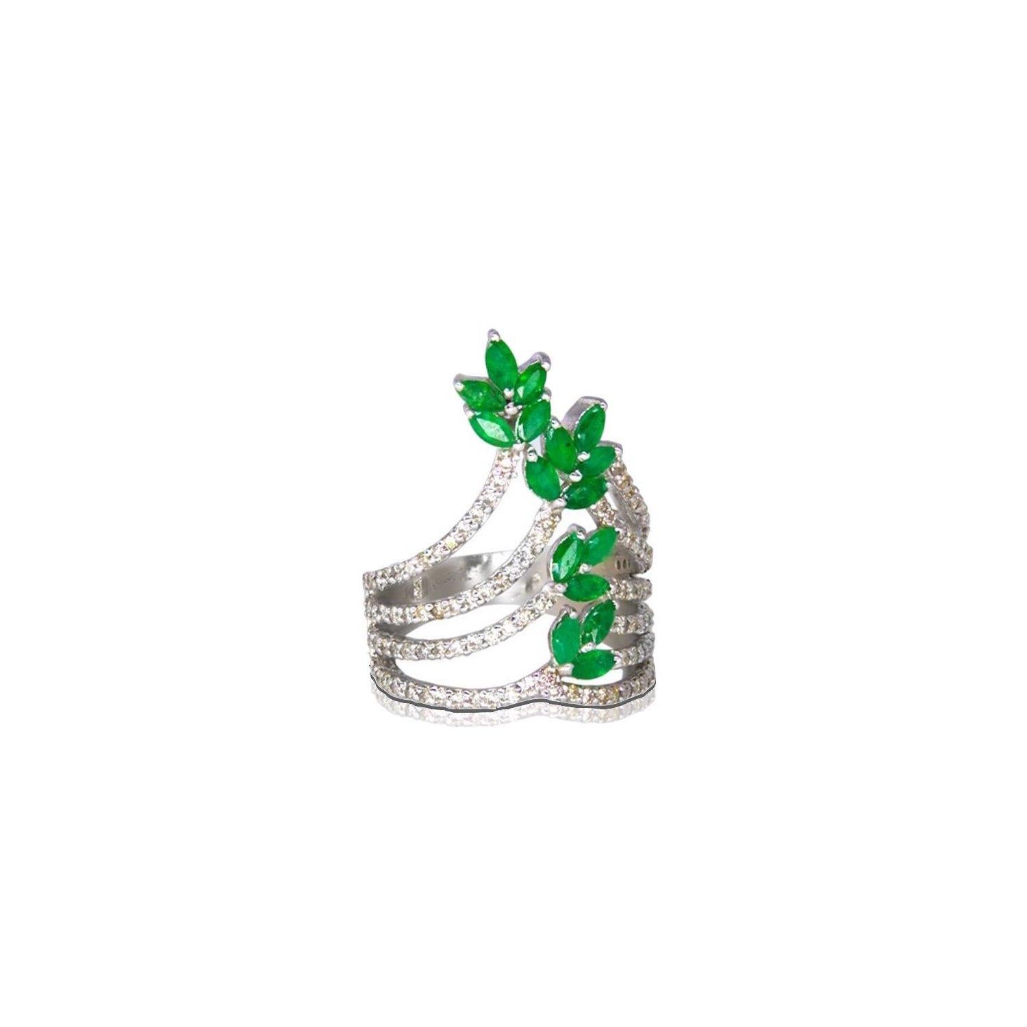 A delicate and contemporary floral design in a beautiful shield ring of Sterling Silver with 18 Karat White Gold high polish.  This ring is set with 2.10 Carats of fiery Emerald leaves and .44 Carats of sparkling White Diamonds.