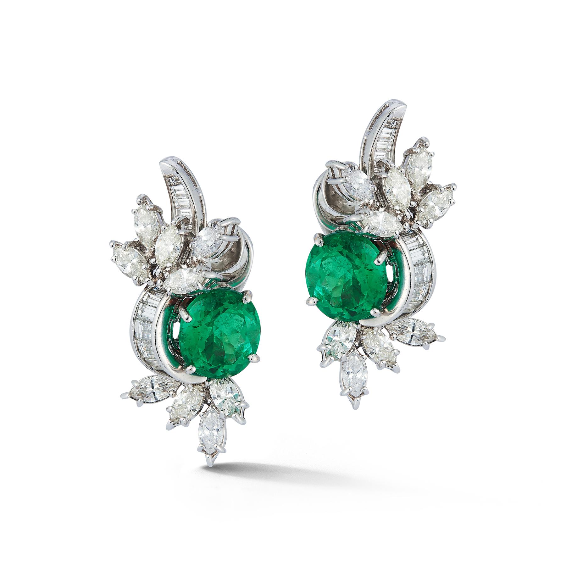 Emerald & Diamond Flower Earrings, 2 round cut emeralds approximately 6.55 cts, 18 marquise cut diamonds approximately 3.09 cts & 26 tapered baguette cut diamonds approximately .90 cts set in platinum.

Measurements: 1