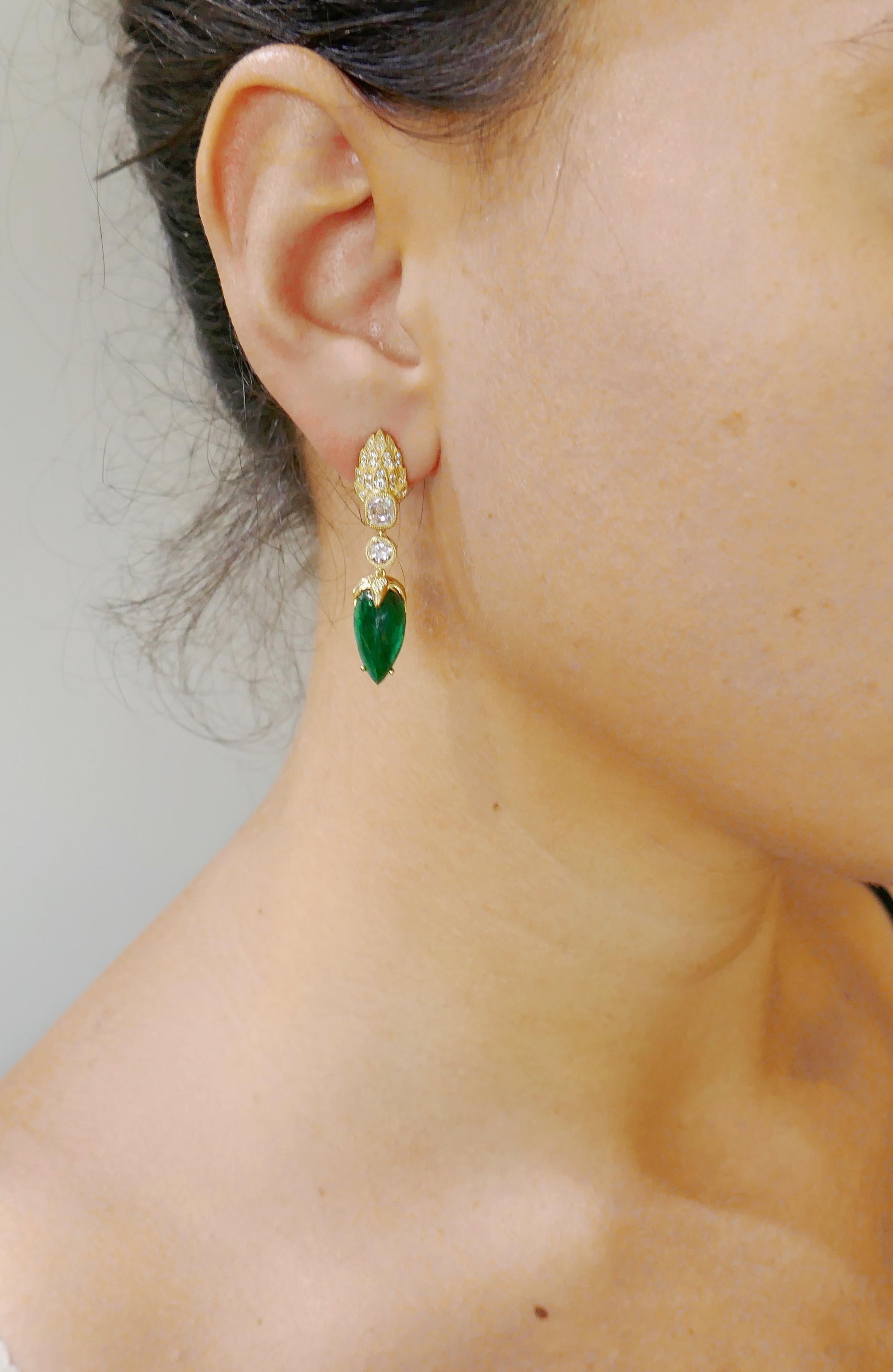 Lovely dangle earrings.  Beautiful color combination of vivid green emeralds and sunshine of yellow gold with a subtle sparkle of diamonds along with an outstanding workmanship make the earrings a great addition to your jewelry collection. 
Made of