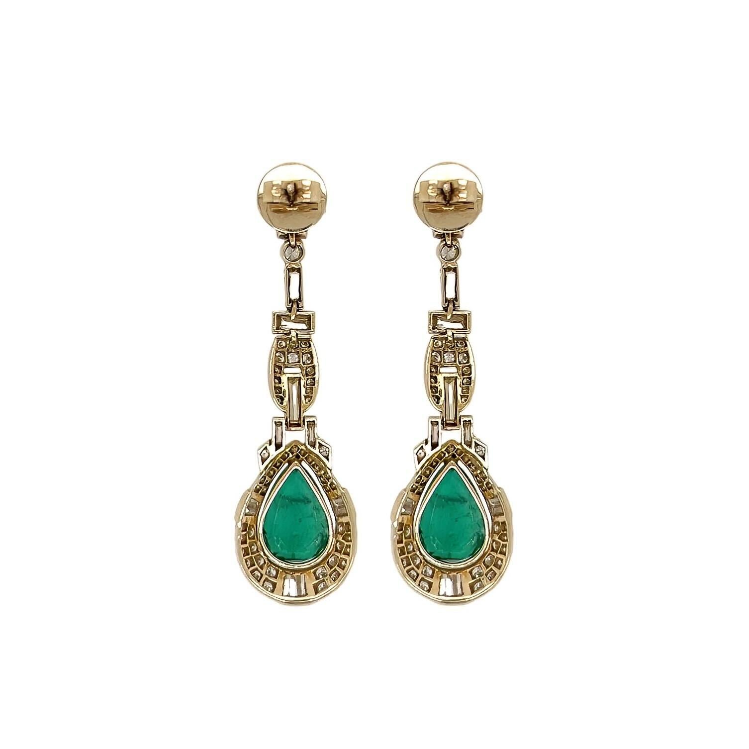 A pair of 18 karat yellow gold, emerald and diamond earrings.  Each drop earring set with approximately 56 round brilliant cut diamonds, 11 baguette cut diamonds and two princess cut diamonds suspending and surrounding a pear shaped emerald weighing