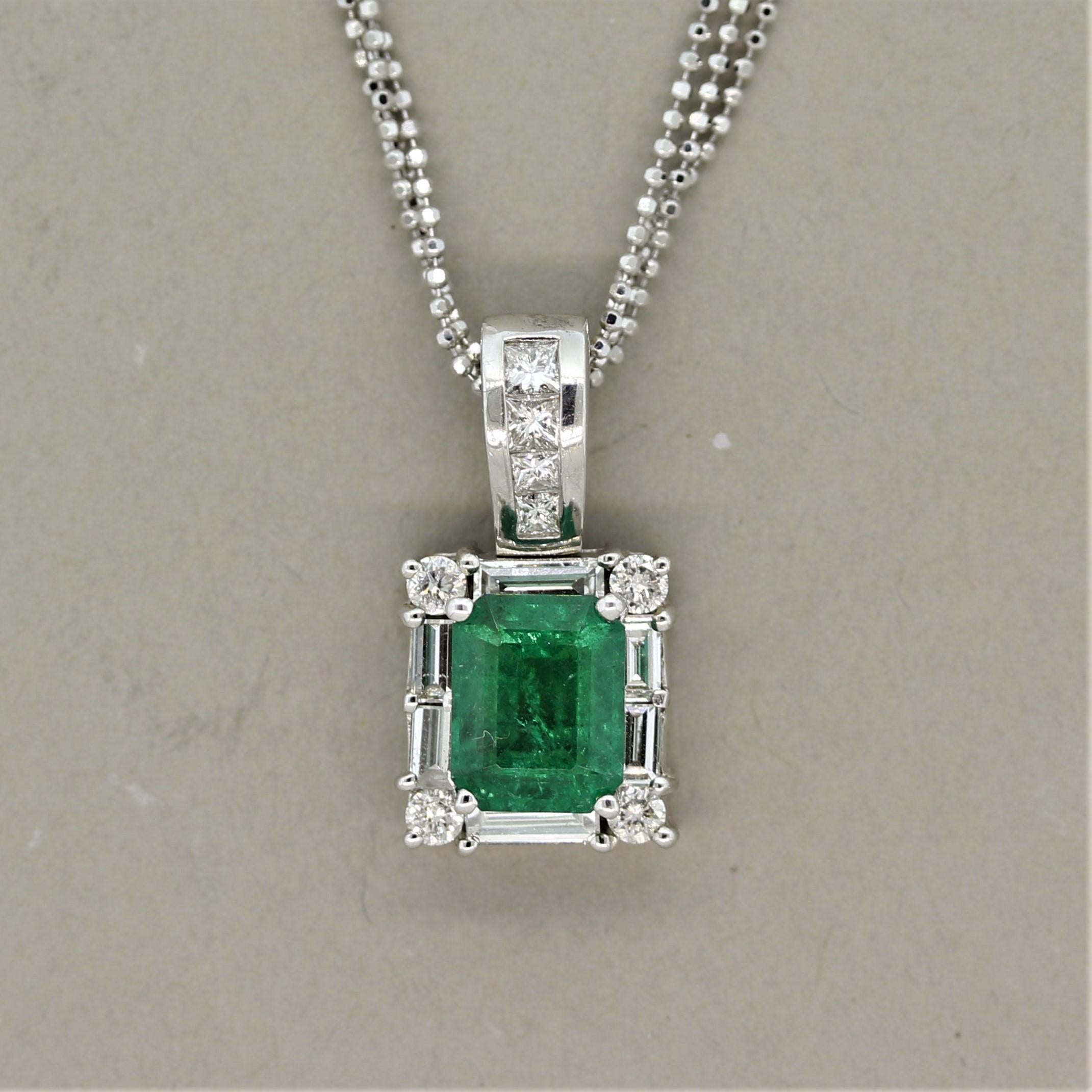 A crystalline gem of an emerald weighing 2.74 carats takes center stage in this pendant. It has a rich bright pure green color that is free of any major inclusions seen in most emeralds. This allows the stone's natural brilliance to shine. It is
