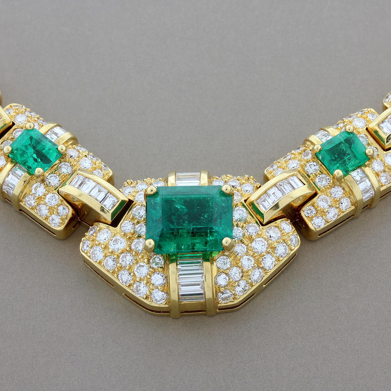 An elegant emerald diamond necklace featuring a 4.35 carat vivid green emerald cut emerald which we believe to have Columbian origin. Two smaller emeralds complement the centerpiece which is covered in approximately 4.50 carats of baguette and