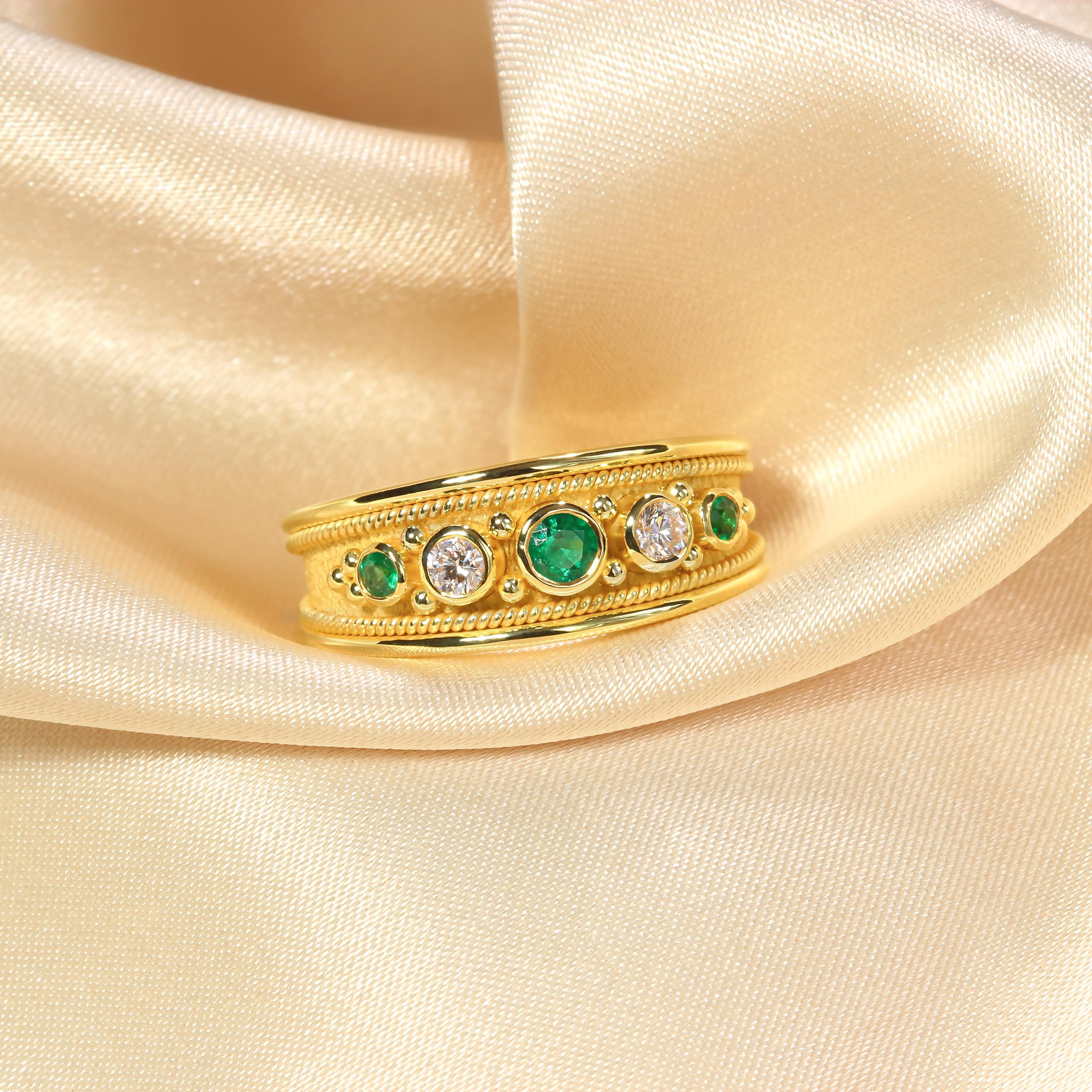 Indulge in timeless elegance with our exquisite gold ring, featuring three lustrous emeralds embraced by the subtle sparkle of two dazzling diamonds. Crafted with precision and adorned with delicate details, this ring exudes sophistication and