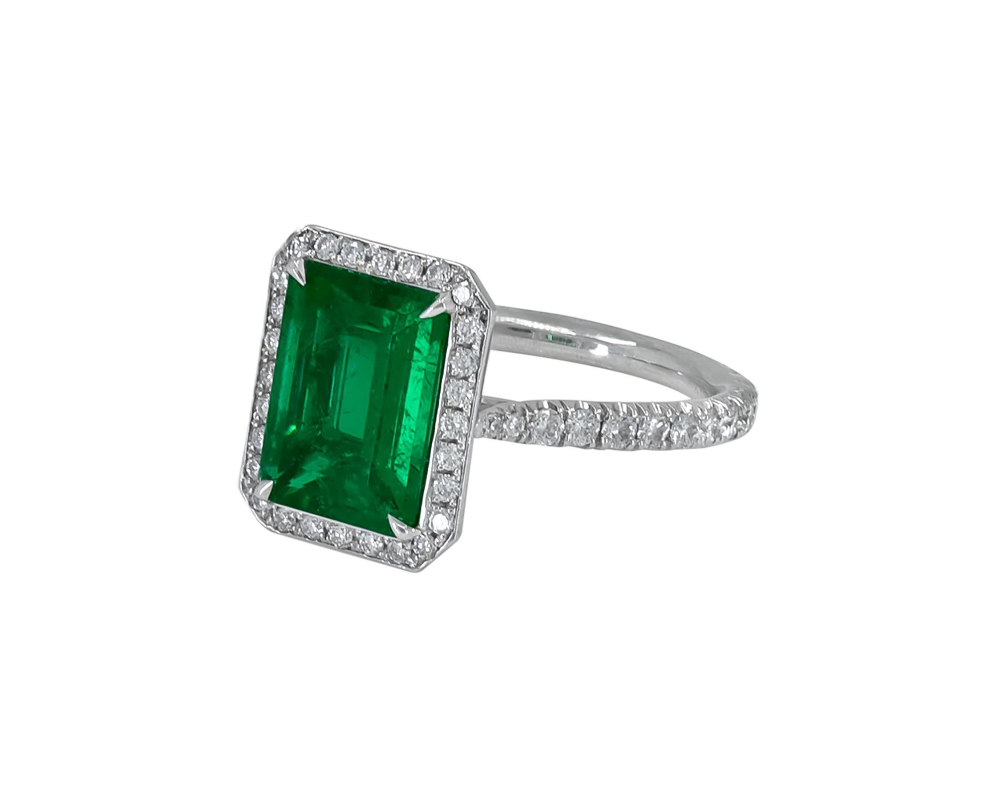 A beautiful cocktail ring comprising of an emerald-cut green emerald weighing 2.03 carats. 
The emerald is accompanied by a GRS report, stating that it's Colombian Muzo green with minor clarity enhancement. Stone dimensions are: 10.02 x 7.43 x 3.66