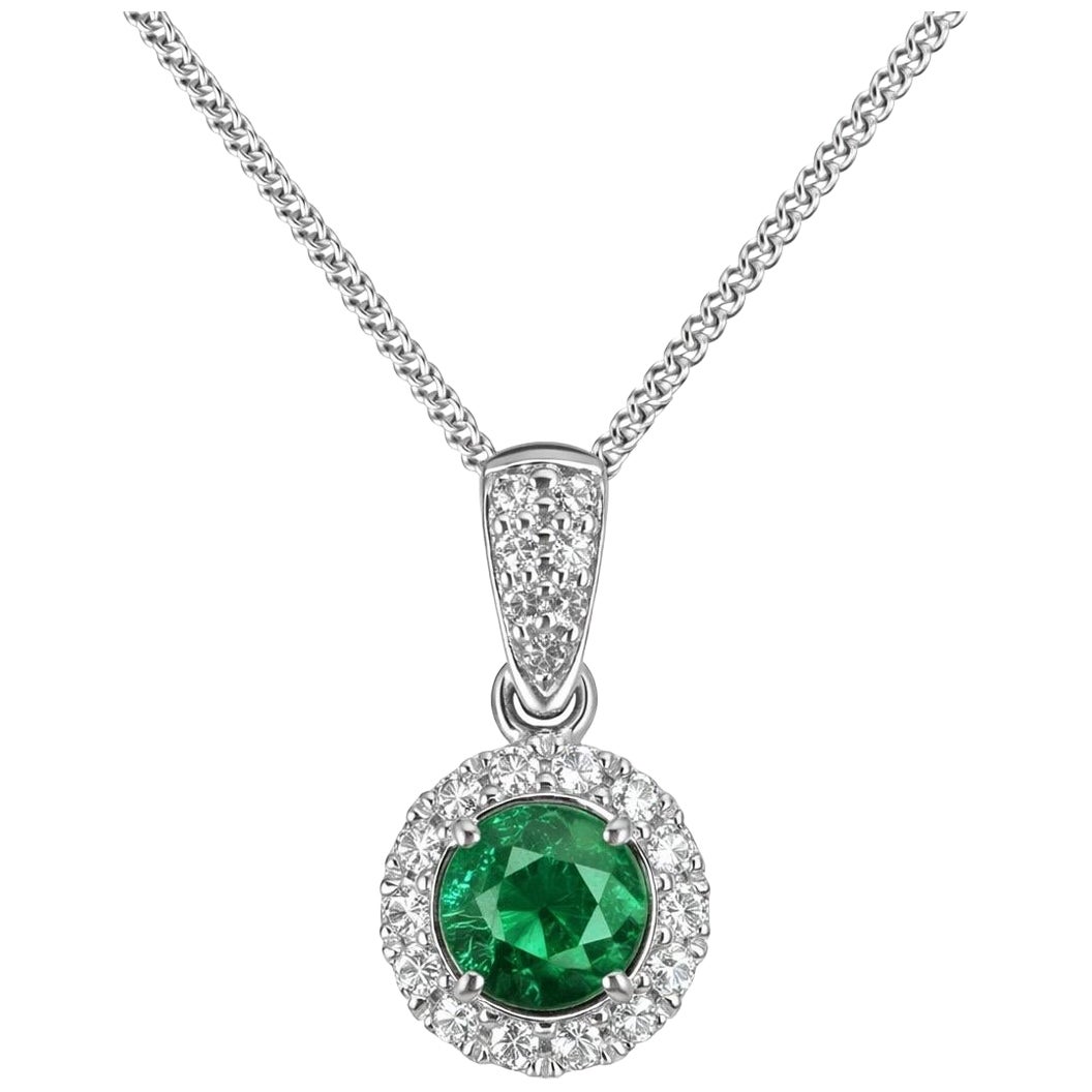 Emerald & Diamond Halo Pendant in 18k white gold For Sale