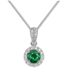 Emerald & Diamond Halo Pendant in 18k white gold