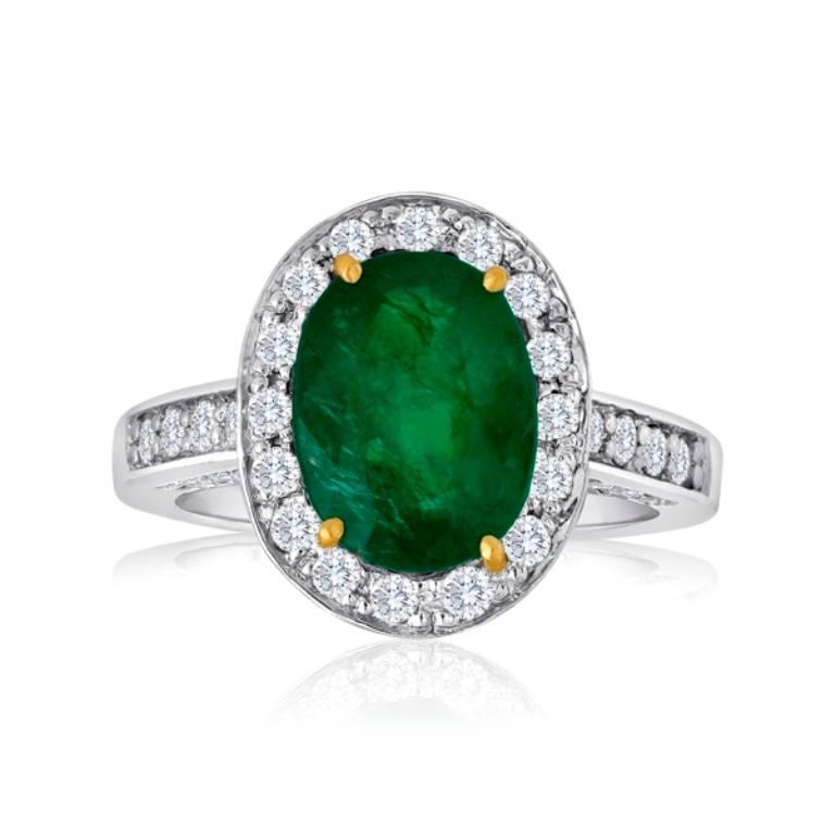 Lovely Emerald Oval 2.98 Carat encircled in a single Halo of White Round Diamonds 0.70 Carat in a Platinum Ring.

MADE IN USA
Total Stone Weight 3.68 Carat