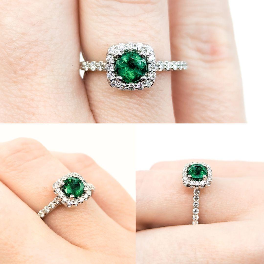 Emerald & Diamond Halo Ring in White Gold

Introducing this beautiful ring crafted in 14kt white gold. The ring features a stunning .50ct emerald centerpiece, the birthstone for May, symbolizing renewal and hope. Emeralds are celebrated for their