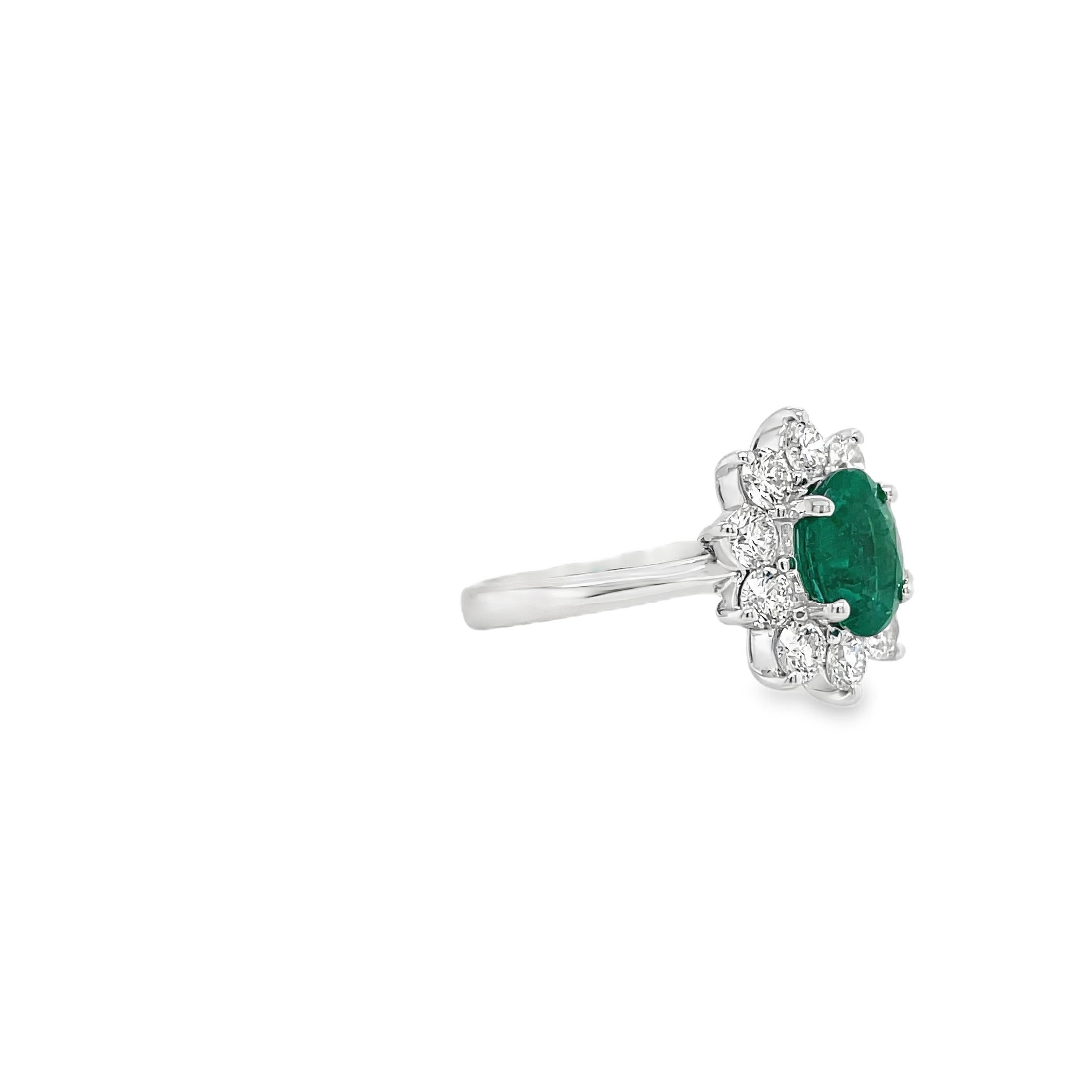 Contemporary Emerald & Diamond Halo Ring in White Gold For Sale