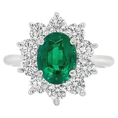 Emerald & Diamond Halo Ring in White Gold
