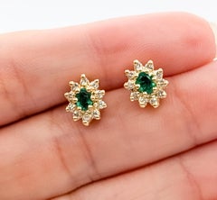 Emerald & Diamond Halo Stud Earrings in 14k Yellow Gold