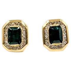 Emerald & Diamond Halo Stud Earrings in 14k Yellow Gold