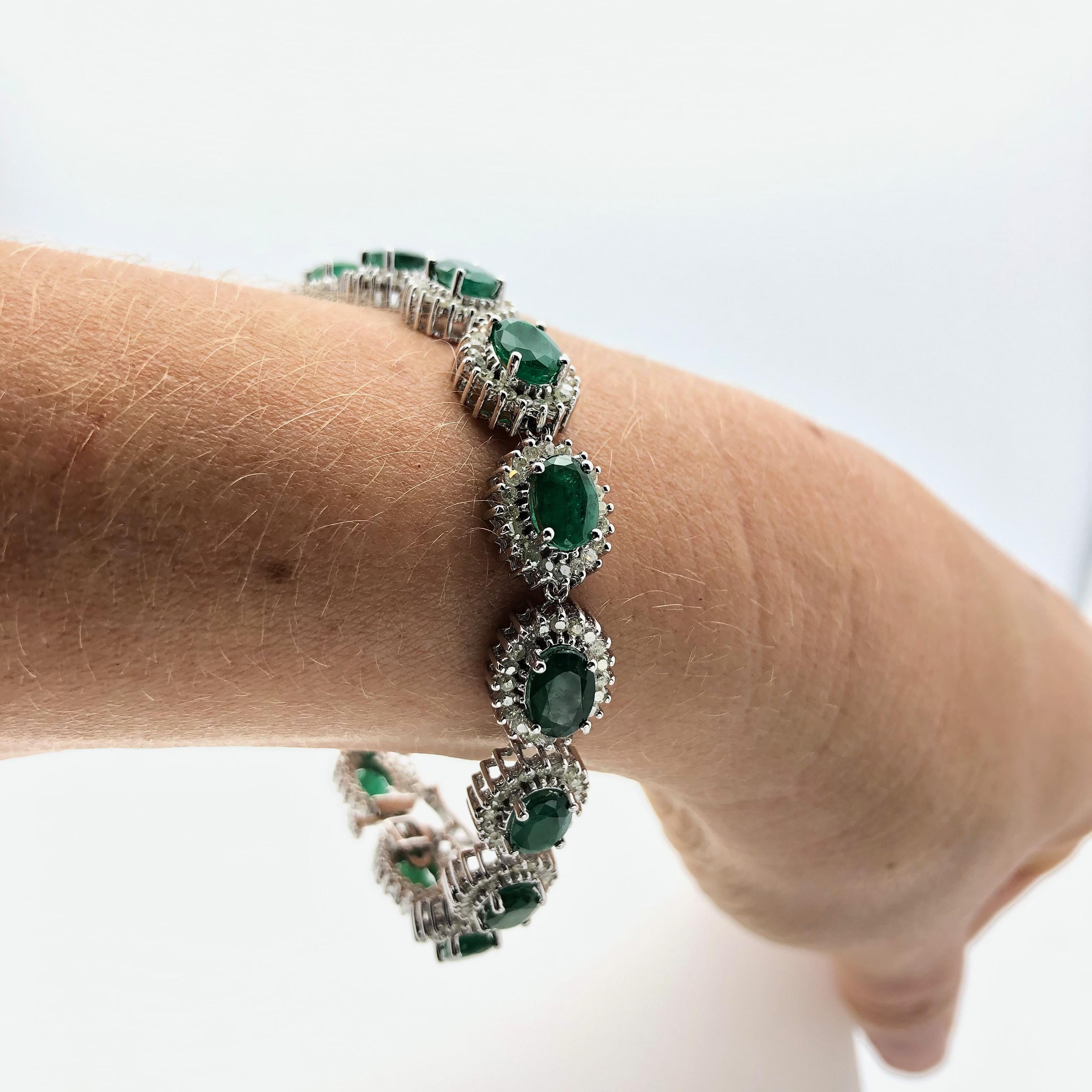 One white gold bracelet mounted with genuine emeralds hi-lighted with genuine diamonds. this entire item weight 19.70 grams, measure 7.5 inches long and 0.4 wide. ( metric 18.5 x 0.5 mm )
-Emeralds 15 oval shape forest green medium dark total weight