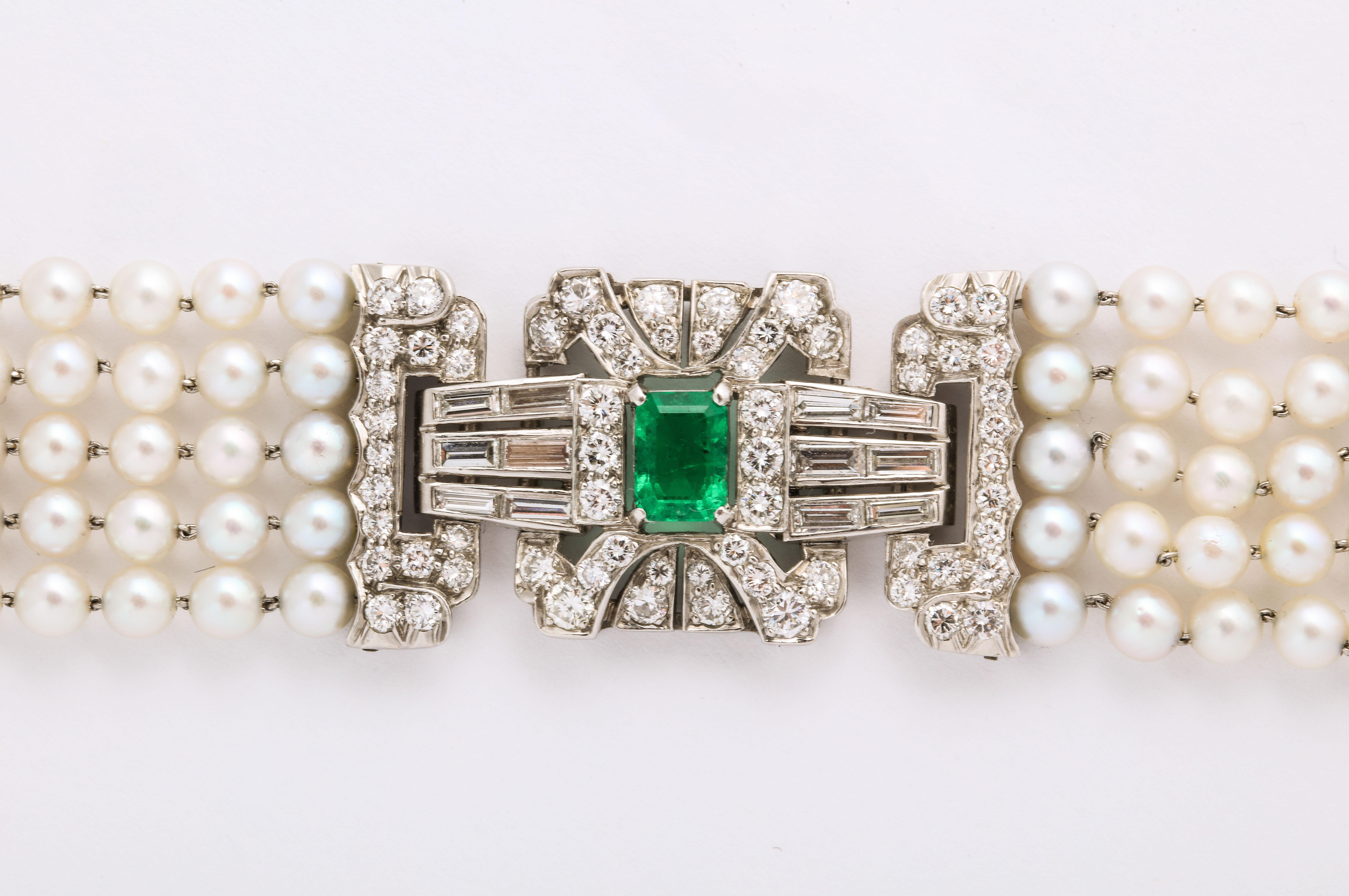 Emerald Diamond Pearl Bracelet in Platinum, unmarked but tested. The diamonds are fine white full cuts and baguettes @ 1 cts tw, and the bracelet measures 7 inches long and 7/8 of an inch wide.

Material:
Platinum 26.5 dwt
Unmarked but
