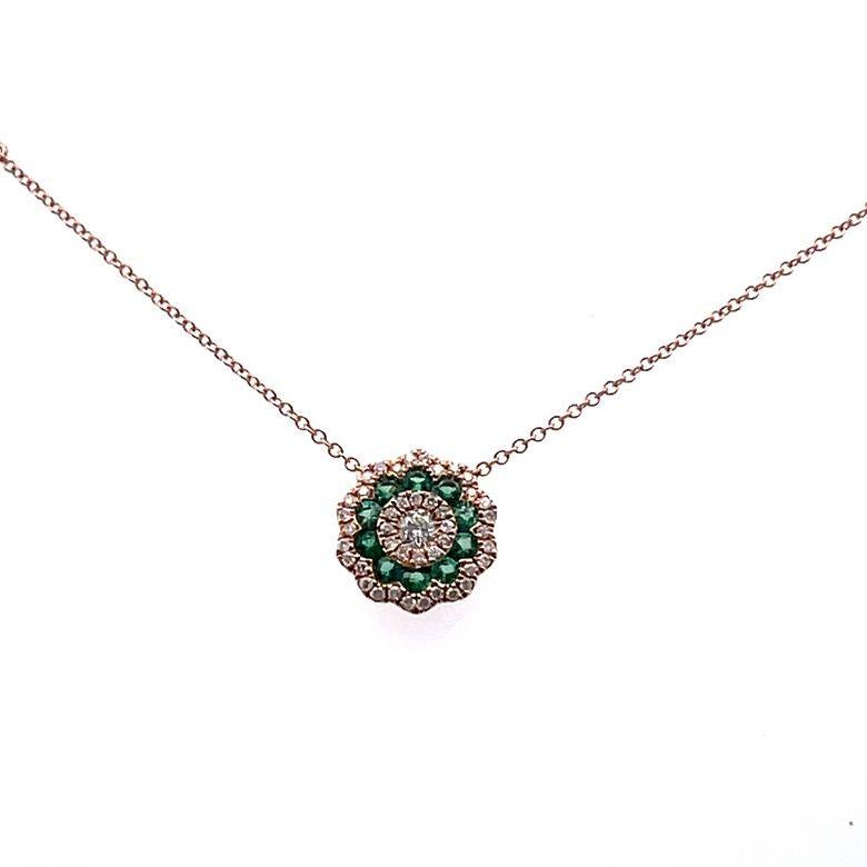 We are delighted to introduce you to our latest masterpiece, the exquisite diamond & emerald flower pendant necklace. This stunning necklace is designed to captivate your senses with its breathtaking beauty and exceptional craftsmanship. The pendant