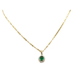 Emerald diamond pendant