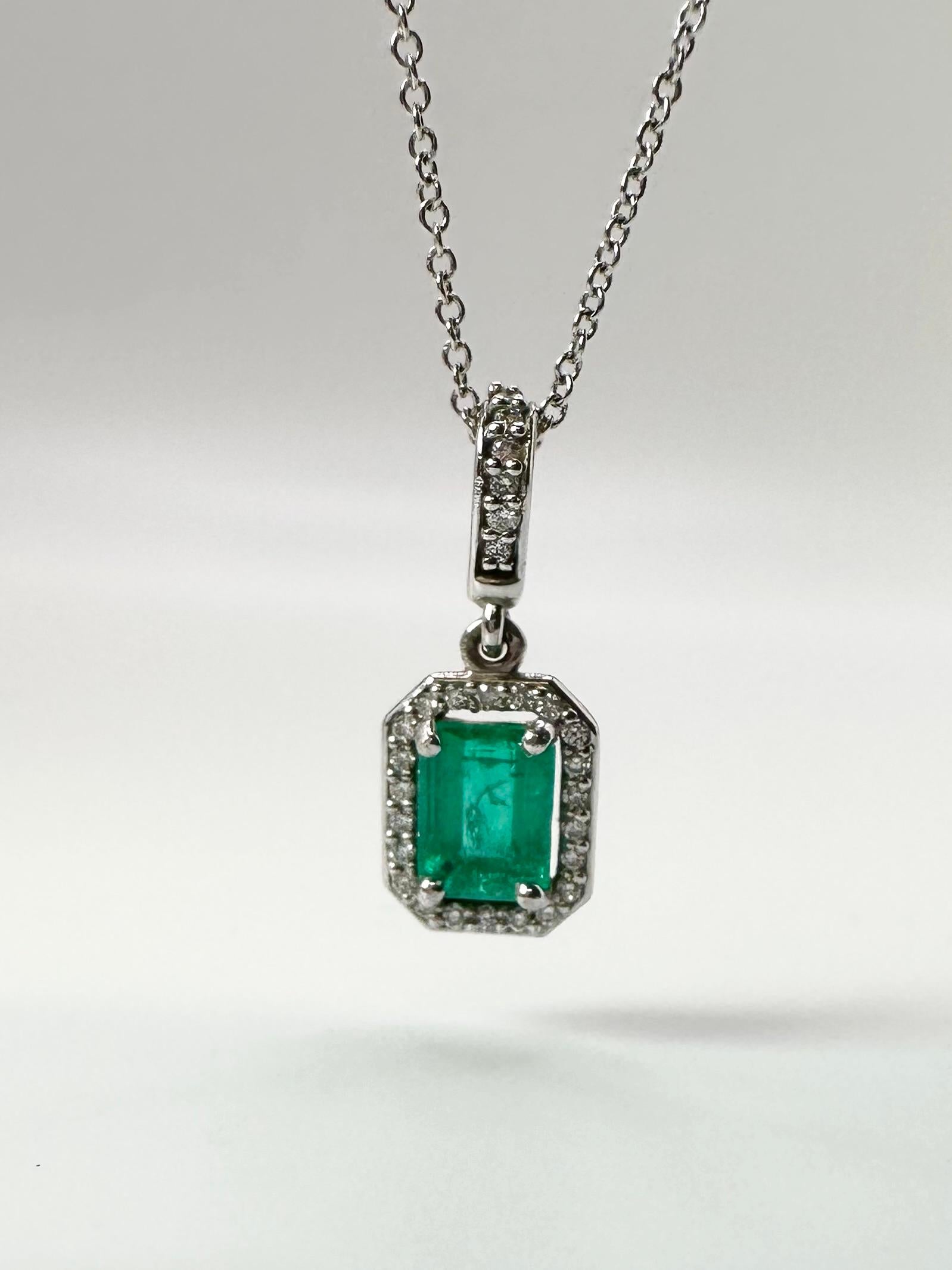 Stunning elegant emerald pendant necklace in 14KT white gold with a gentle halo of diamonds on a 18” chain.


GRAM WEIGHT: 2.33gr
GOLD: 14KT gold
NATURAL EMERALD(S)
Clarity/Color: Slightly Included/Green
Carat:1.20ct
NATURAL DIAMOND
Color/Clarity: