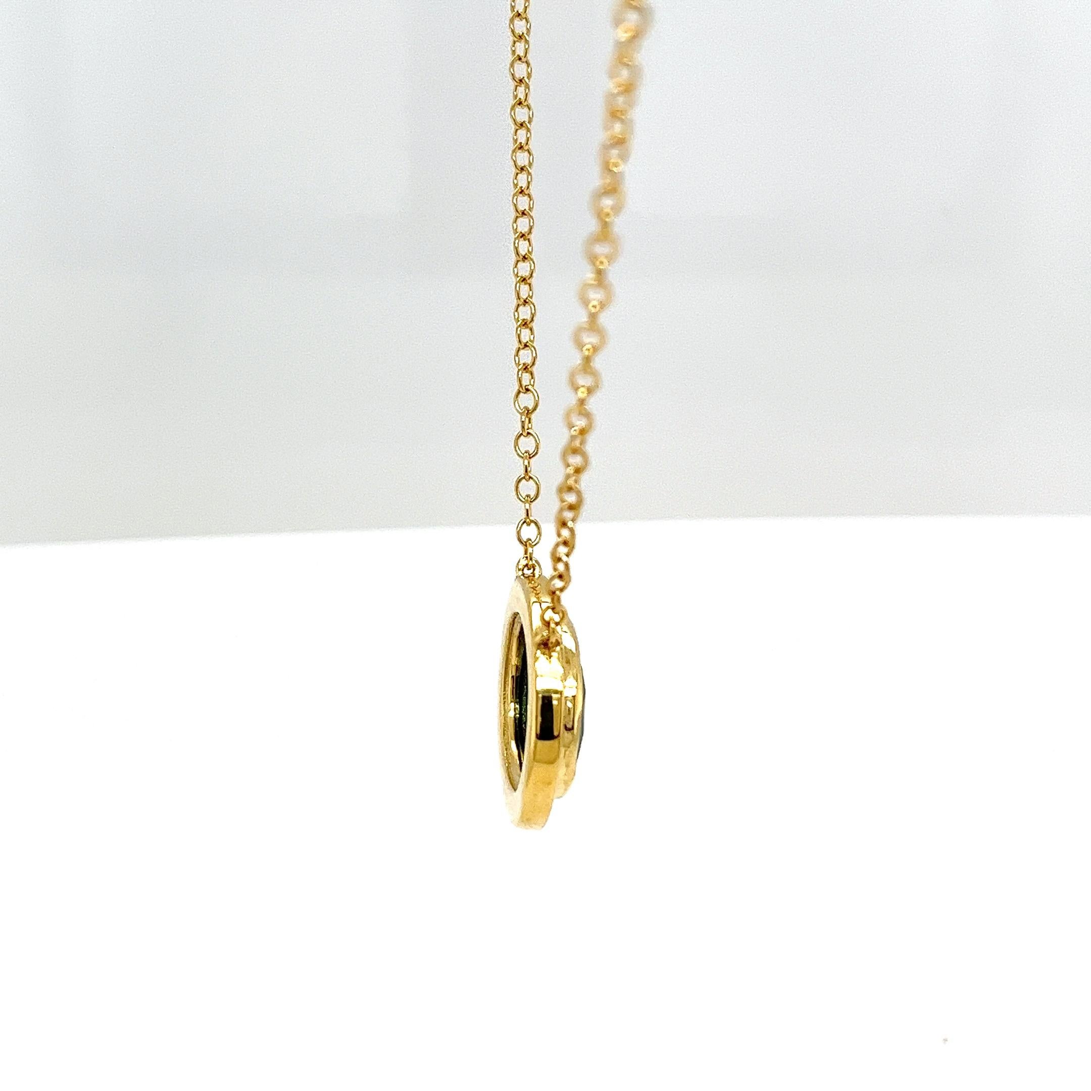 This stunning pendant showcases a vibrant emerald, 
elegantly framed by a sparkling halo of natural round brilliant cut diamonds, all beautifully set in rich 18ct yellow gold. A perfect blend of timeless design and refined elegance.


Total Emerald