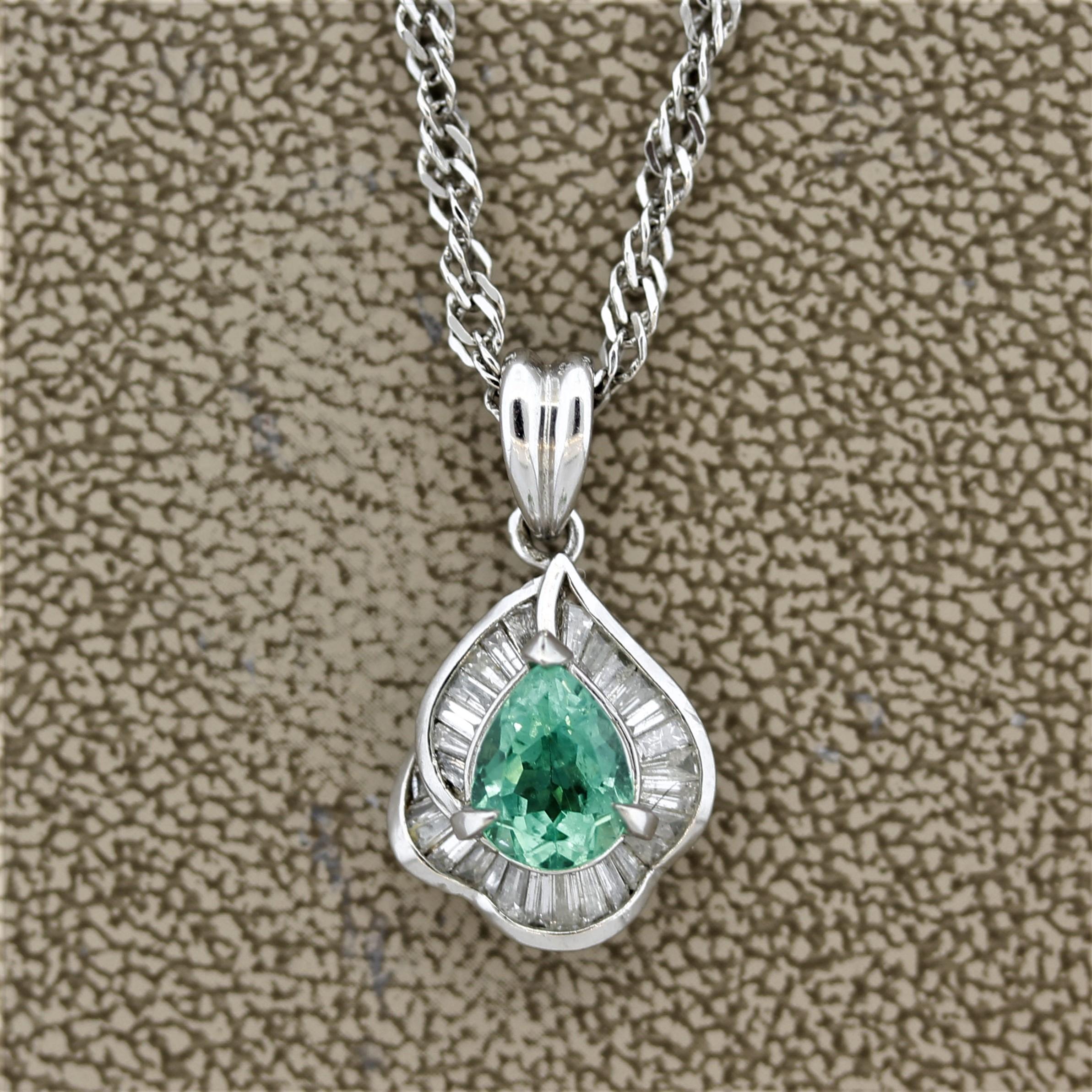 A sweet pendant featuring a 0.88 carat pear shape emerald with a bright green color. It is accented by 0.47 carats of baguette cut diamonds set around the emerald. Hand-fabricated in platinum and ready to be worn!

Pendant Length: 1 inch

Chain