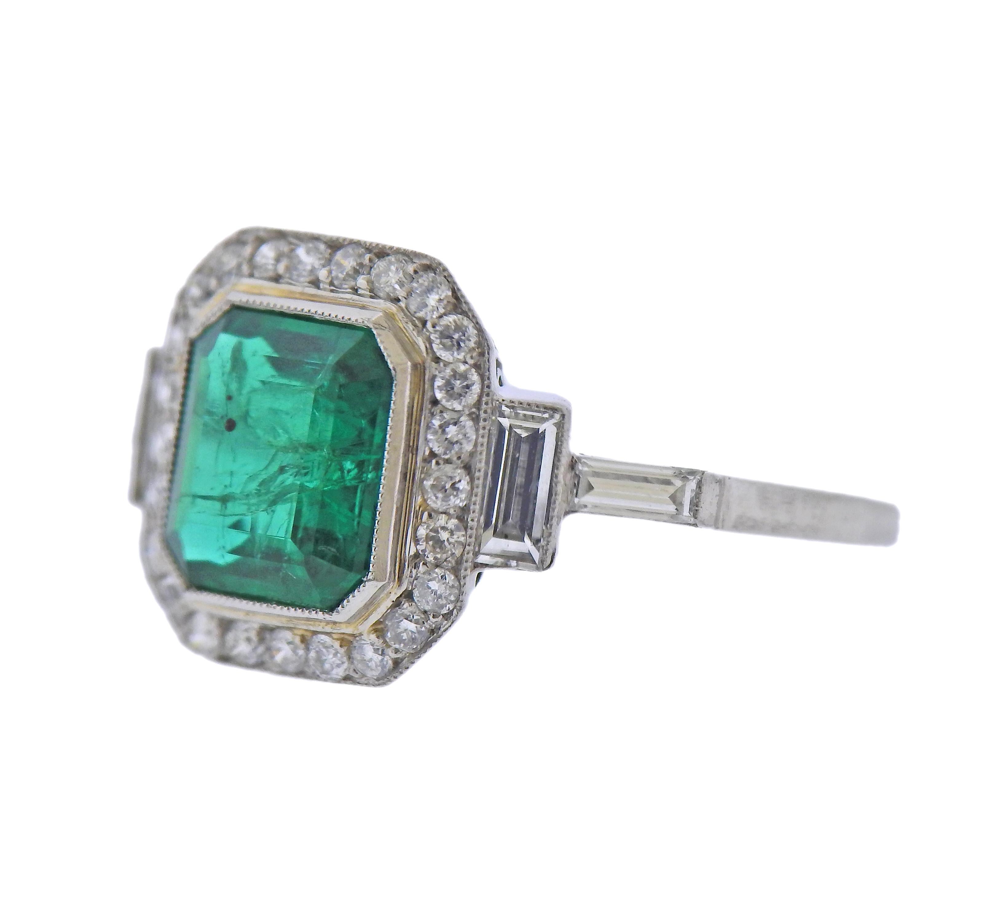 Platinum ring, set with an approx. 1.57ct emerald, and approx. 0.44ctw in diamonds. Ring size - 6.5, ring top - 13mm x 20mm. Tested plat. Weight - 3.7 grams.