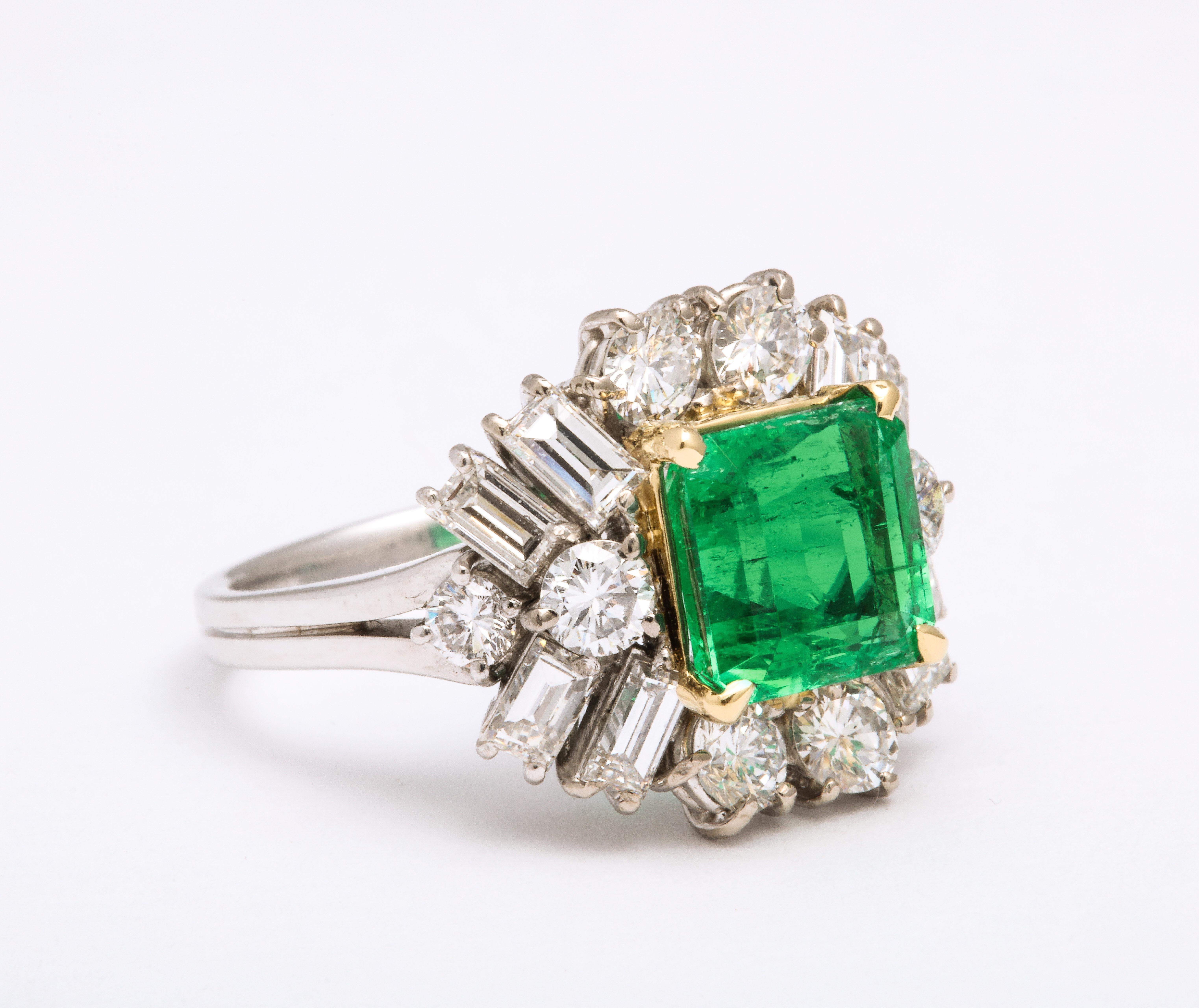 Emerald Diamond Platinum Ring, circa 2000. In the center is a 1.25 cts tw square cut emerald surrounded by fine white baguette and full cut diamonds. Size 6 1/2.

Materials:
Platinum 4.1 dwt

Stones:
Square cut emerald 1.25 cts tw
Fine white