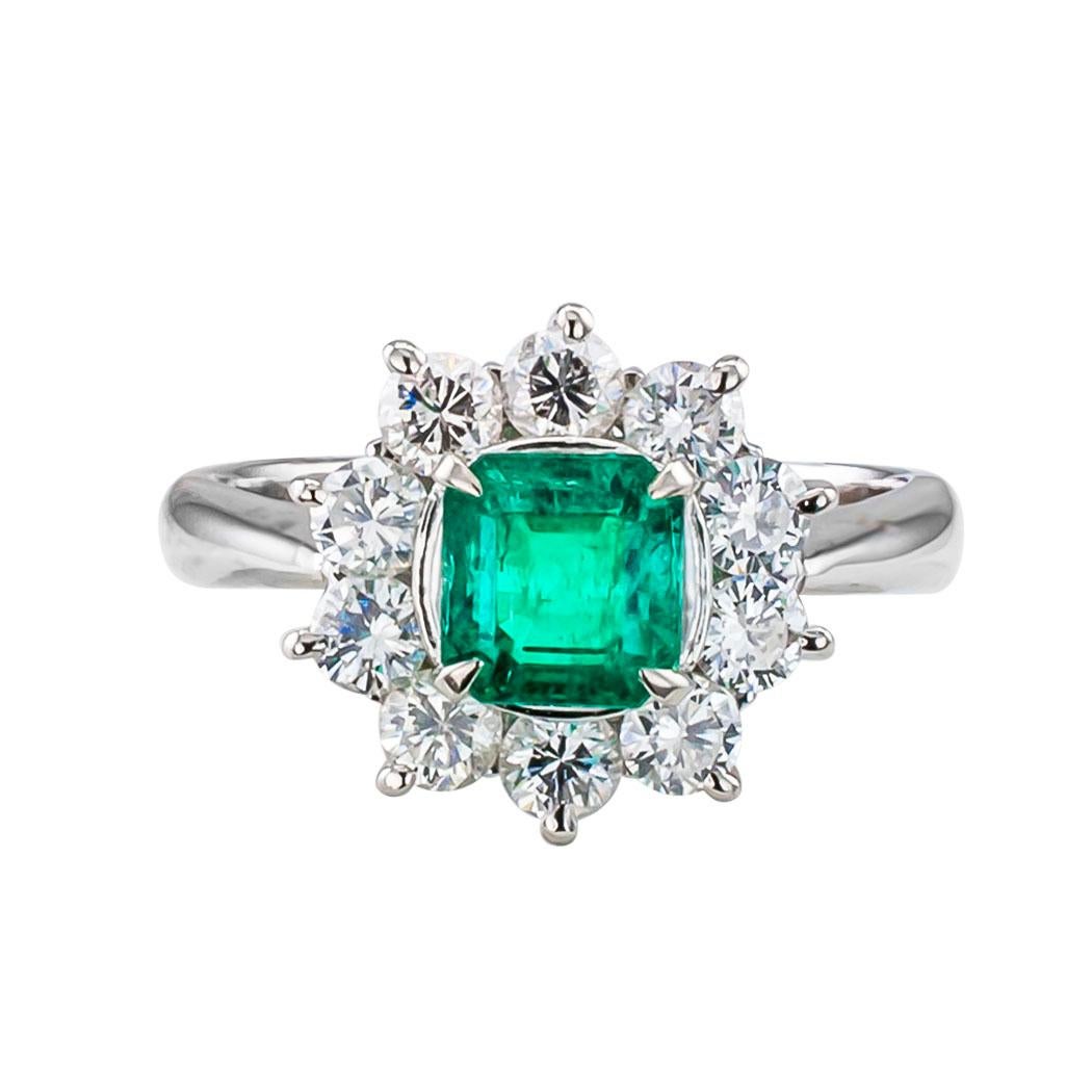 Emerald and diamond cluster ring circa 1990. *

ABOUT THIS ITEM:  #A7426. Scroll down for detailed specifications.  The Colombian emerald shows a beautiful deep green color and the diamonds have been matched for color and cut, set in a mounting that