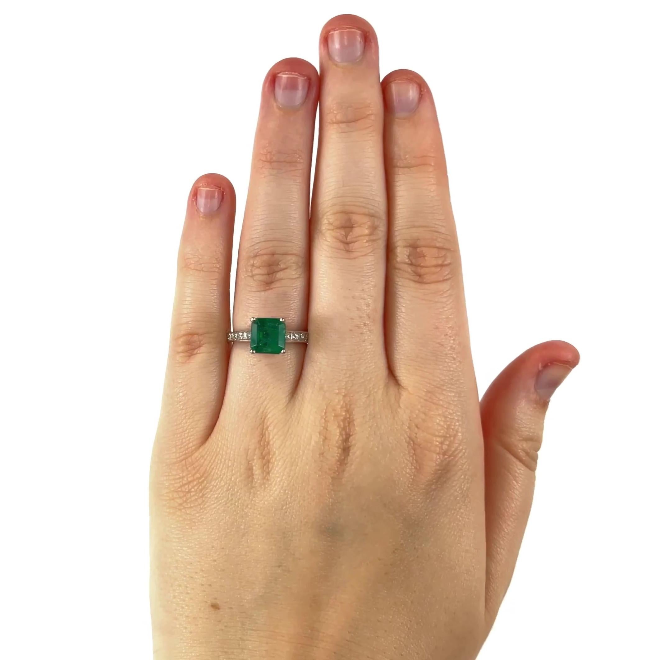 One Emerald Diamond Platinum Ring. Featuring one square shaped emerald of 2.01 carats. Accented by 16 princess cut diamonds with a total weight of approximately 0.80 carats, graded F-G color, VS clarity. Crafted in platinum with purity mark. Circa