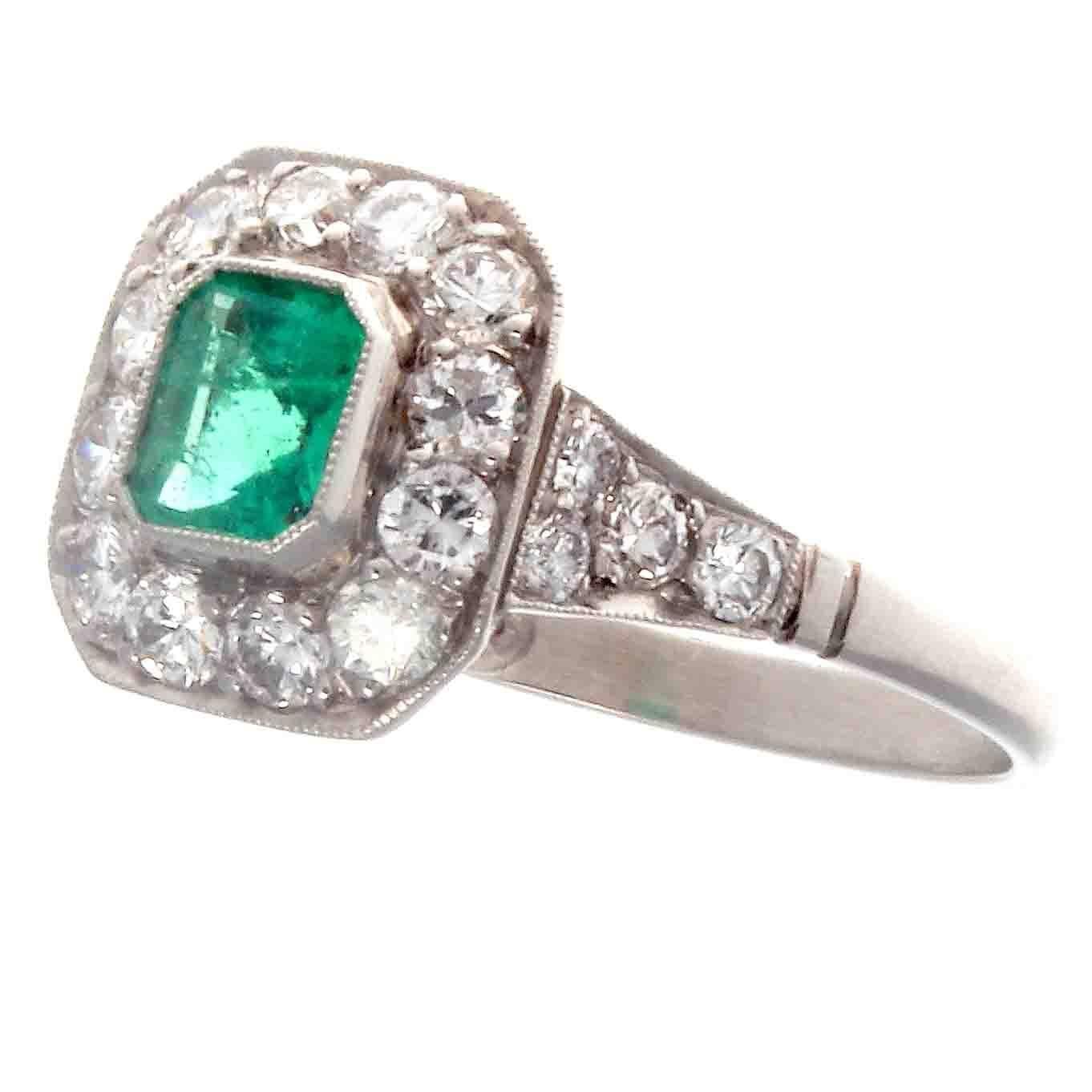 Intrinsically beautiful, using color and traditional design referencing the golden era of art deco jewelry. Featuring a vibrant gem quality emerald surrounded by a halo of near colorless diamonds. Hand crafted in platinum.

Ring size 6 and can