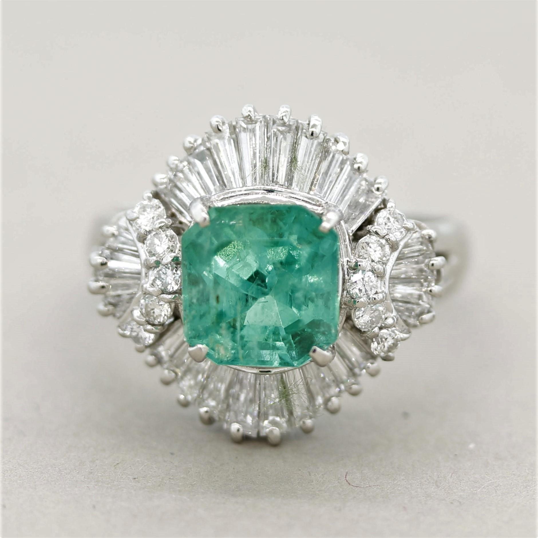 A luxurious and fine platinum ring! It features a 2.38 carat square-shaped emerald-cut emerald with a bright and vibrant green color. It is accented by 1.29 carats of round brilliant-cut and baguette-cut diamonds set in a stylish pattern around the