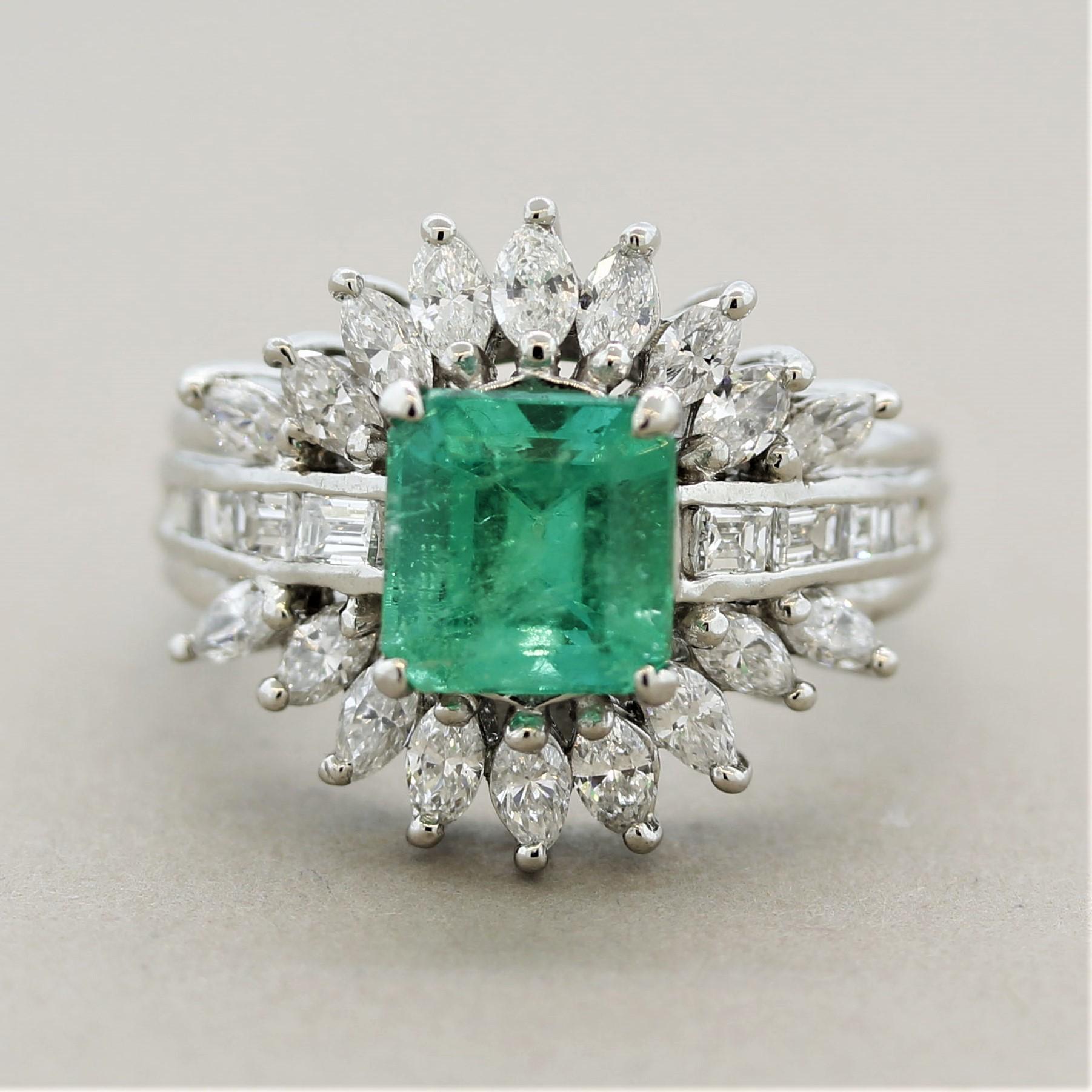 A bright and lively platinum ring featuring a fine 2.02 carat emerald. It has a bright vivid green color and is free of any large noticeable inclusions. Accenting the piece are 1.35 carats of baguette-cut and marquise-shaped diamonds set around the