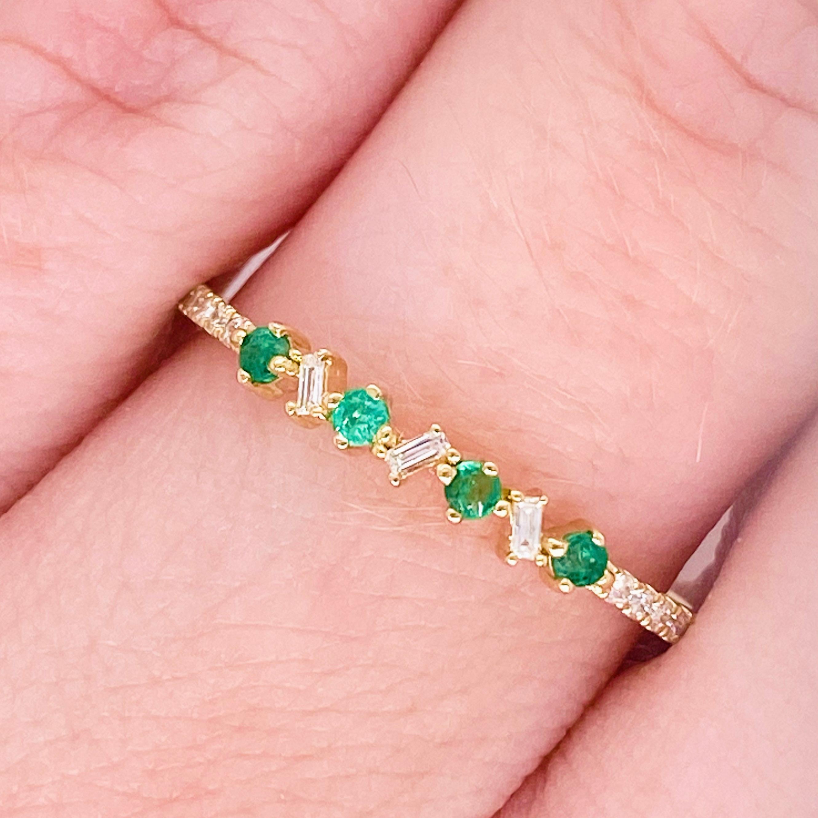 Vibrant emeralds and bright white diamonds have never looked better! This emerald and diamond band has genuine, natural round emerald gemstones set next to bright baguette and round white diamonds. The stones are set in an 14 karat yellow gold band!