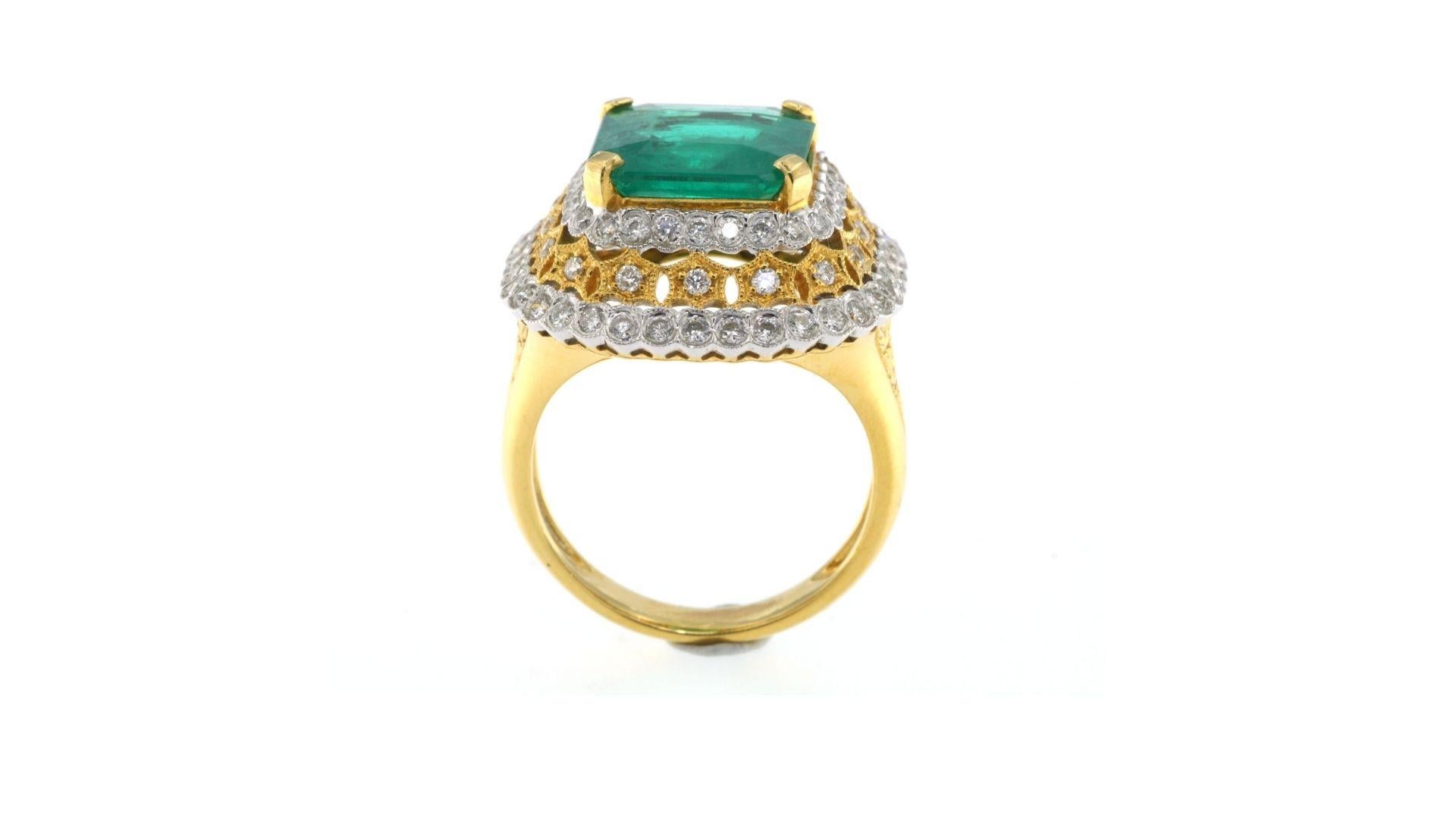 
This is unique Emerald ring  showing off 4.378ct and surrounded by 80 diamonds  and also you will see a pattern in the gold at each side of the ring too. If your looking for something different then this is a good choice. 

Let us know your size