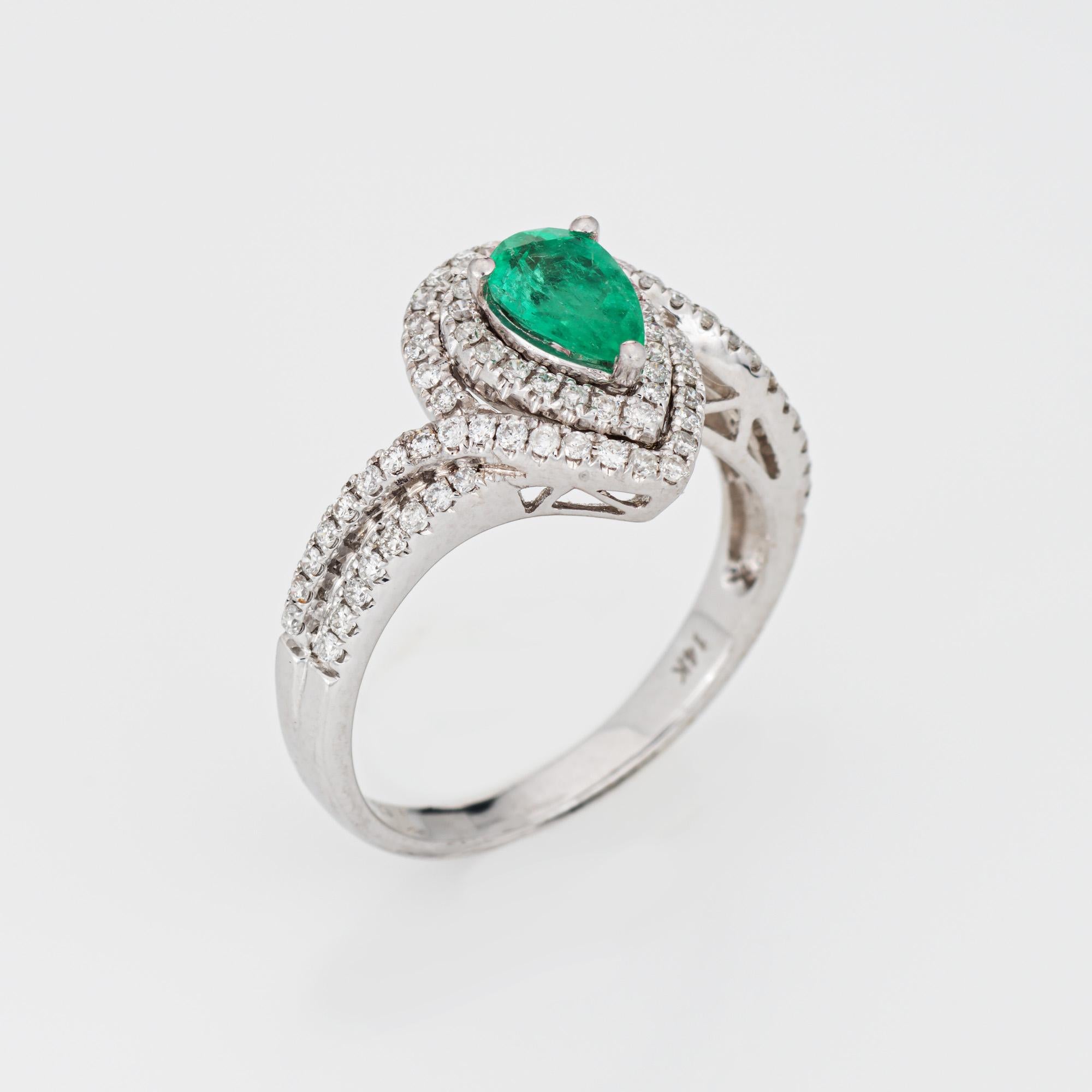 Stylish emerald & diamond ring crafted in 14 karat white gold. 

Pear cut emerald is estimated at 0.40 carats. Diamonds total an estimated 0.51 carats (estimated at H-I color and SI2-I2 clarity). The emerald is in very good condition and free of