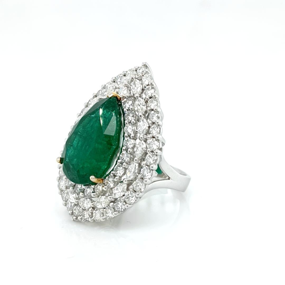 16.01 Cts Pear cut emerald accented by diamonds 5.49 Cts marquise and round brilliant cut

Set in 18K 2-Tone, 13.79 Grams Total 


