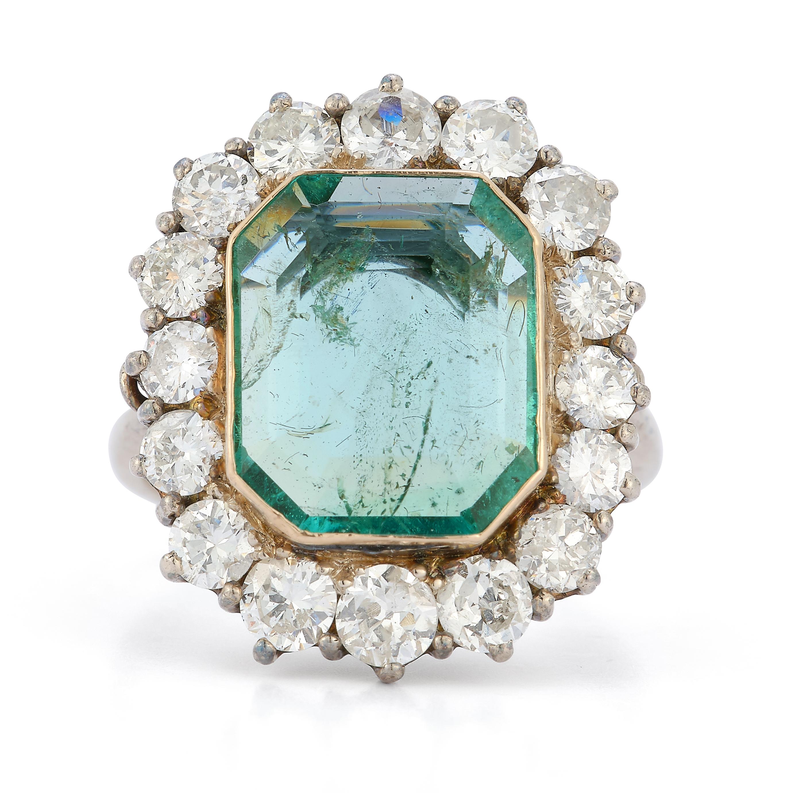 Emerald & Diamond Halo Ring

A central emerald cut emerald of approximately 3.5ct with a halo of round cut diamonds set in 14k white gold

Diamonds total approximate weight: 2.4ct

Ring Size: 8.5