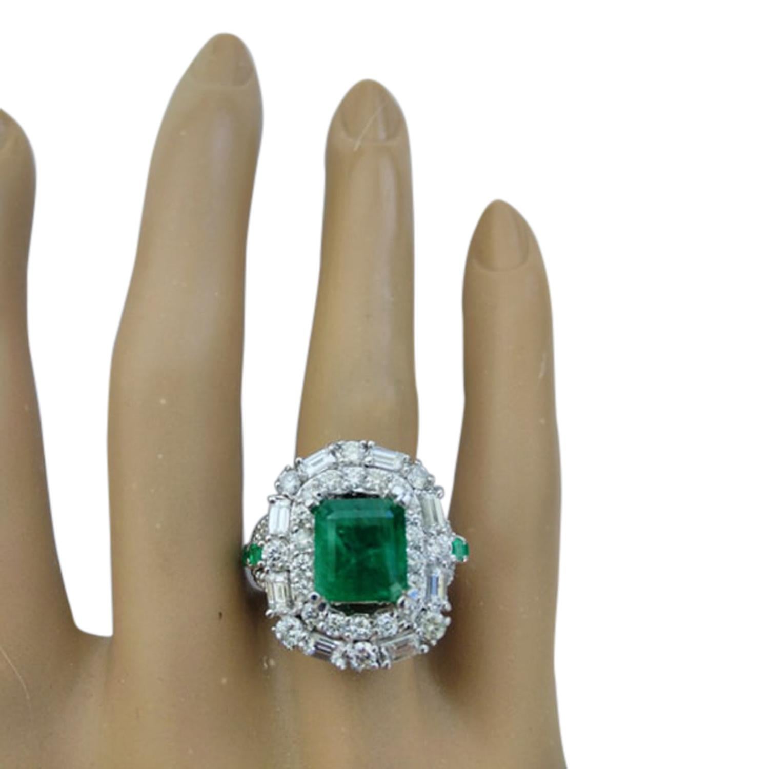 5.50 Carat Natural Emerald 14 Karat Solid White Gold Diamond Ring
Stamped: 14K 
Total Ring Weight: 11.3 Grams 
Center Emerald Weight: 3.10 Carat (10.00x8.00 Millimeters) 
Side Emerald Weight: 0.40 Carats
Diamond Weight: 2.00 Carat (F-G Color,