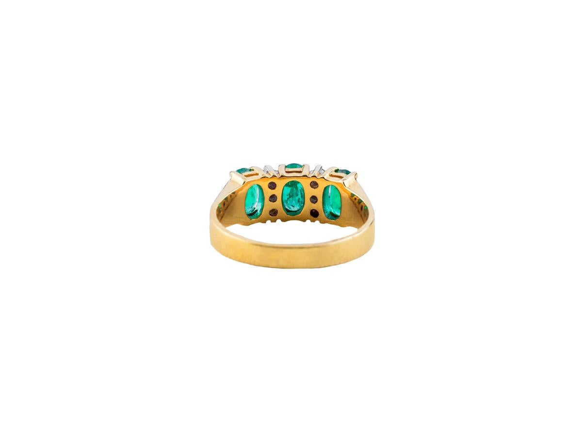 750/18k yellow gold
hallmarked with fineness
Four Colombian. Emeralds together 1,25 k 
4 diamonds together 0,06 k

Ring size: 53/13 can be changed
Weight: 5 grammes