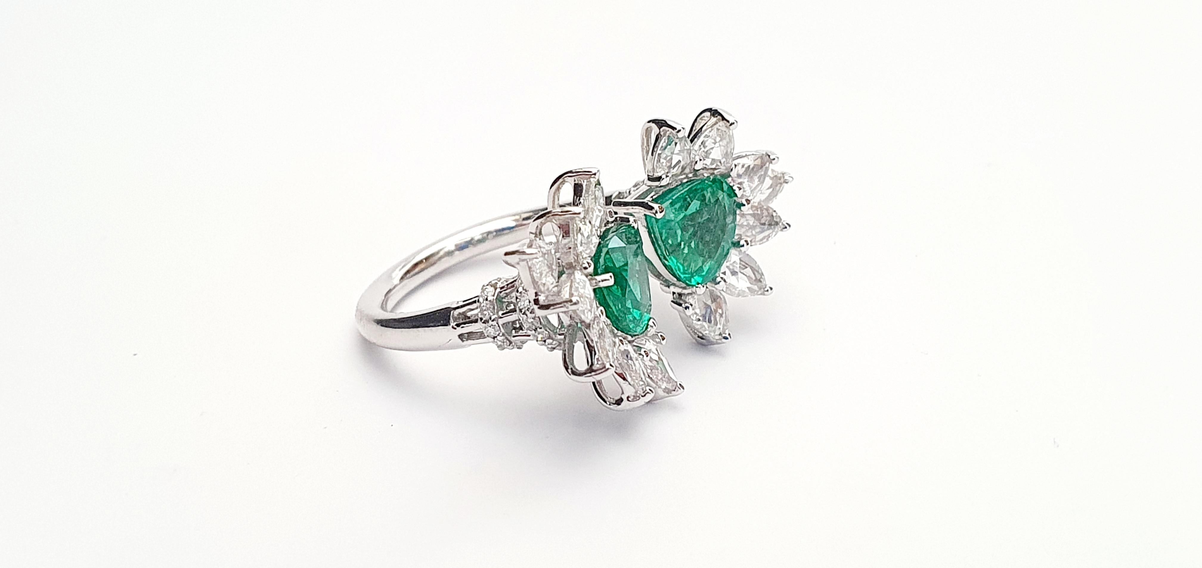 It's an exclusive emerald & diamond ring studded in 18k white gold with 2 pcs of trillion shaped emeralds weight 2.02 Cts with 14 pcs of pear shaped rose cut diamonds weight 1.37 Cts & 0.25 Cts of round shaped diamonds, this entire ring is made of