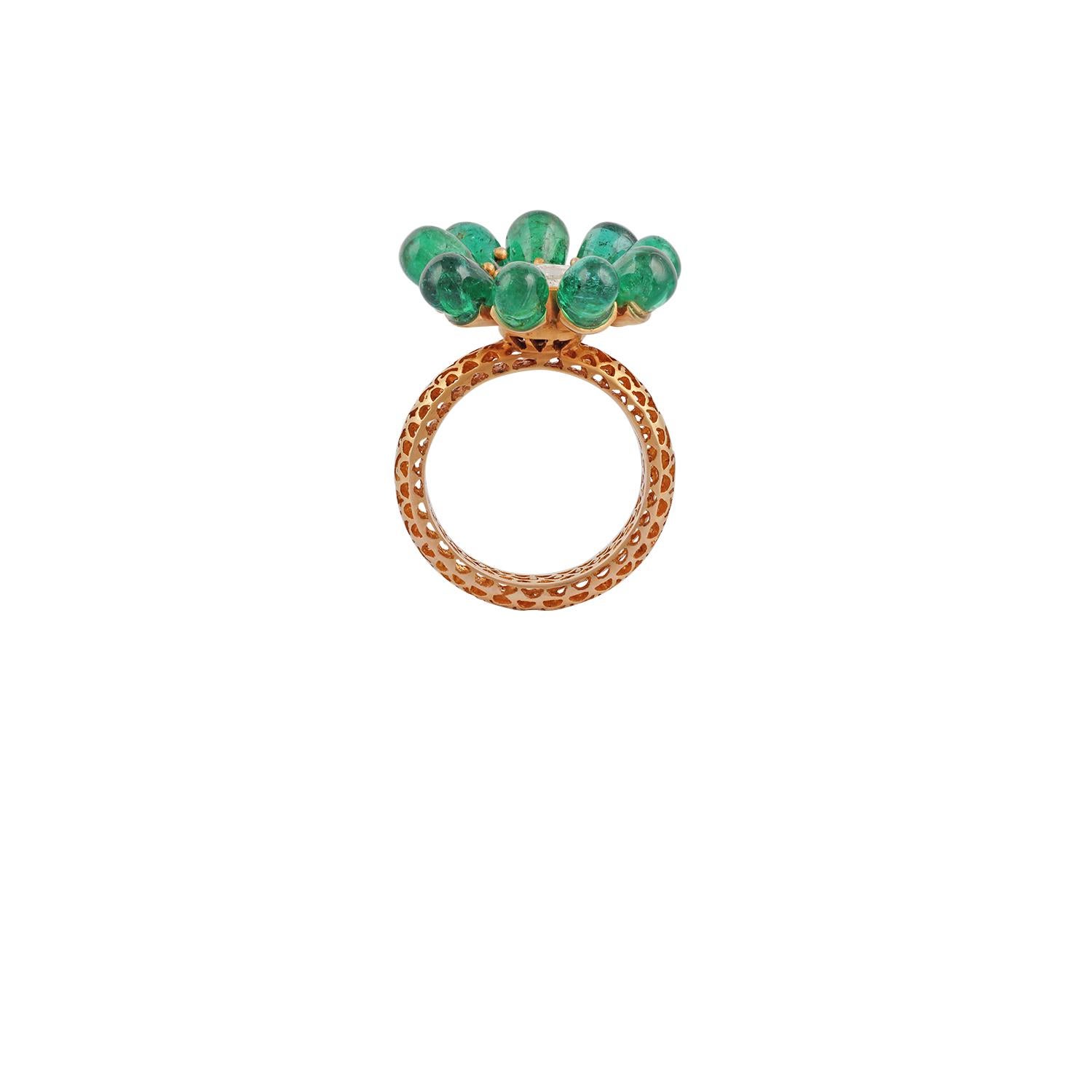 This is a designer drop-shaped fine emerald & rose cut diamond ring studded in 18k yellow gold, features 9 pieces of emerald weight 10.40 carats, 1 piece of rose-cut diamond weight 1.06 carat the total weight of gold in the ring is 5.28 grams, The