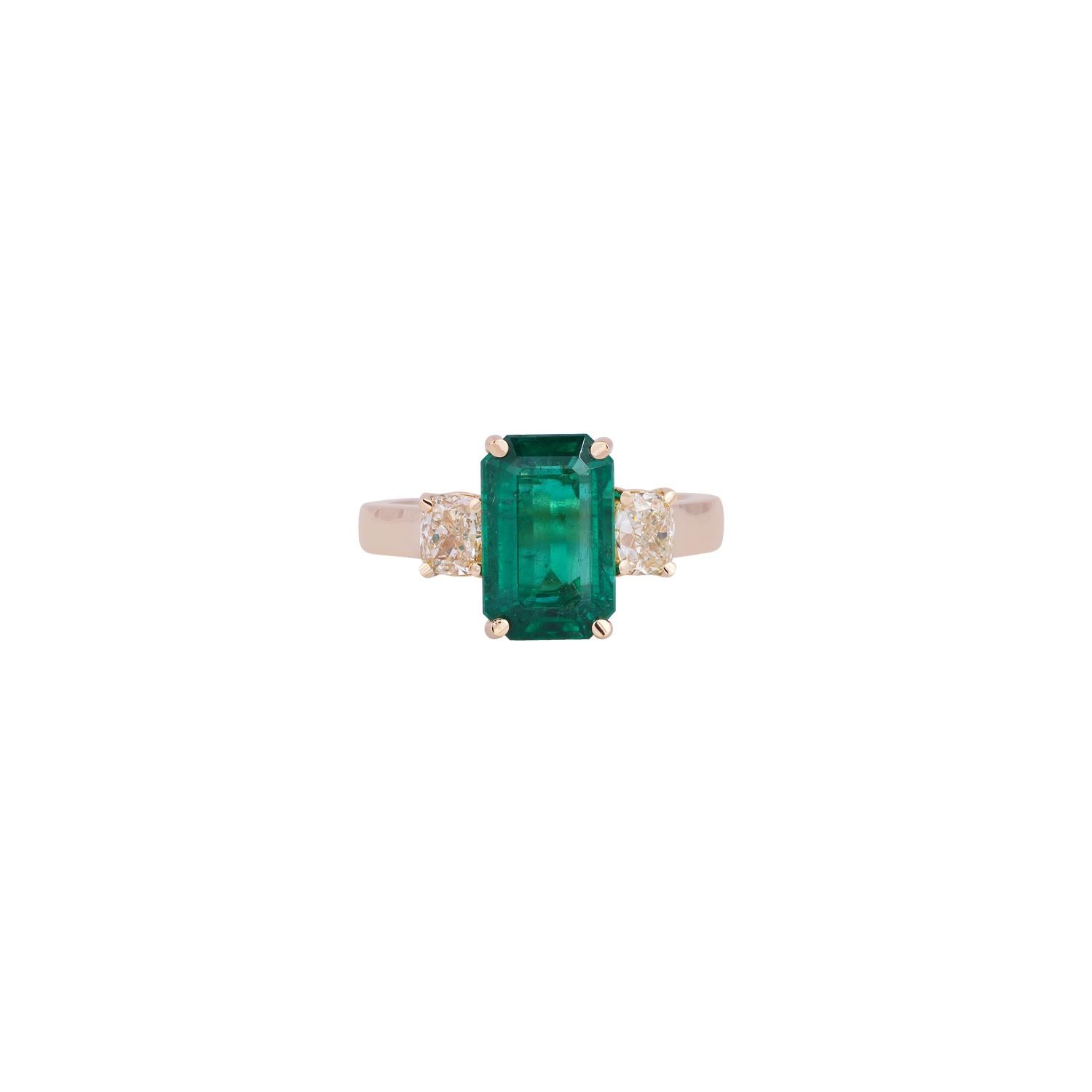 This is an elegant emerald & diamond ring studded in 18k yellow gold features a fine quality of octagon-shaped emerald weight 3.34 carats with 2 pieces of cushion-shaped mutual cut yellow diamonds weight 0.95 carats, this entire ring is made in 18k