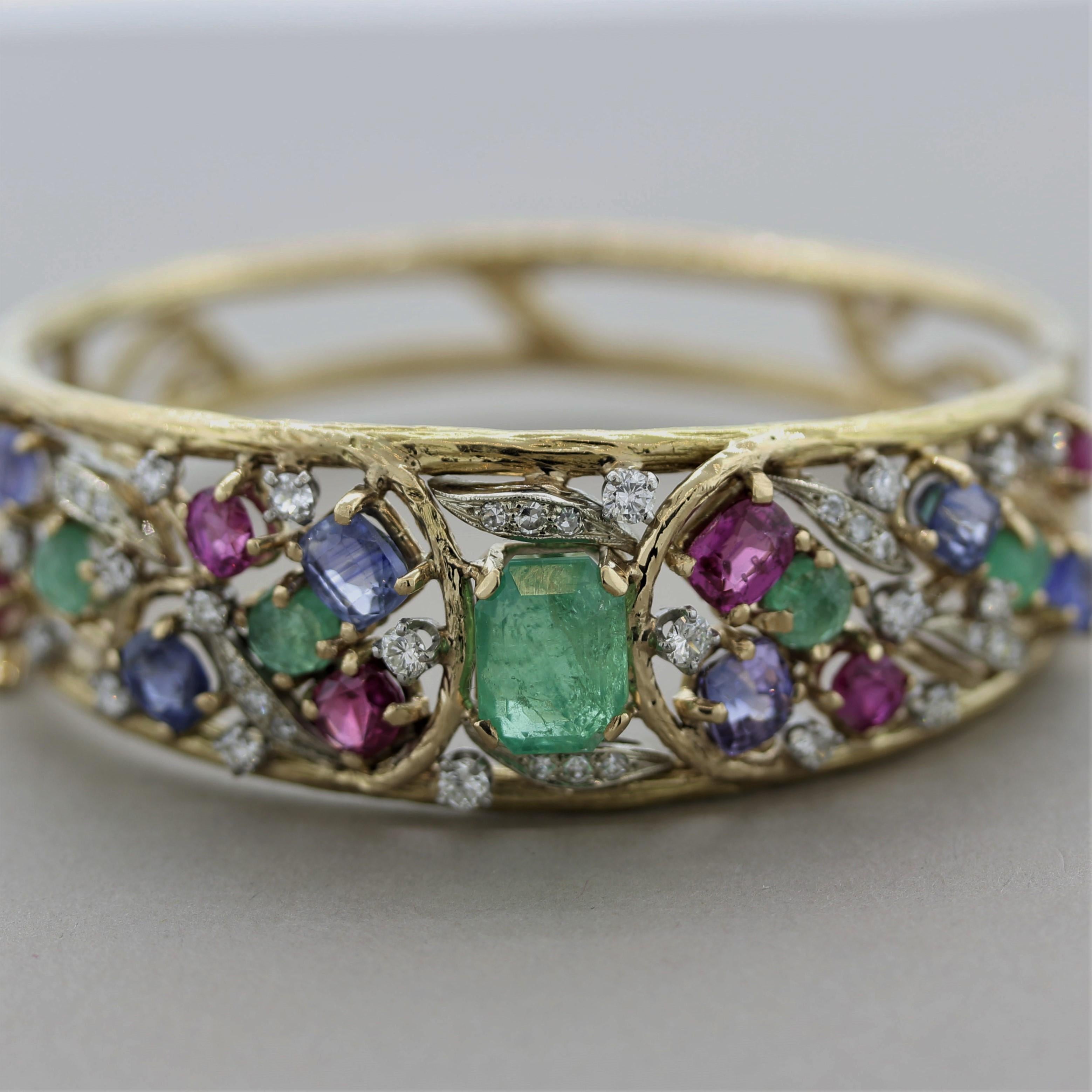 A hand-made treasure from the 1970’s! It features approximately 5 carats of emeralds (largest 3.50 carats), 4.75 carats of sapphire and 2.60 carats of fine rubies. Adding to that are 1 carat of round brilliant-cut diamonds which add sparkle and