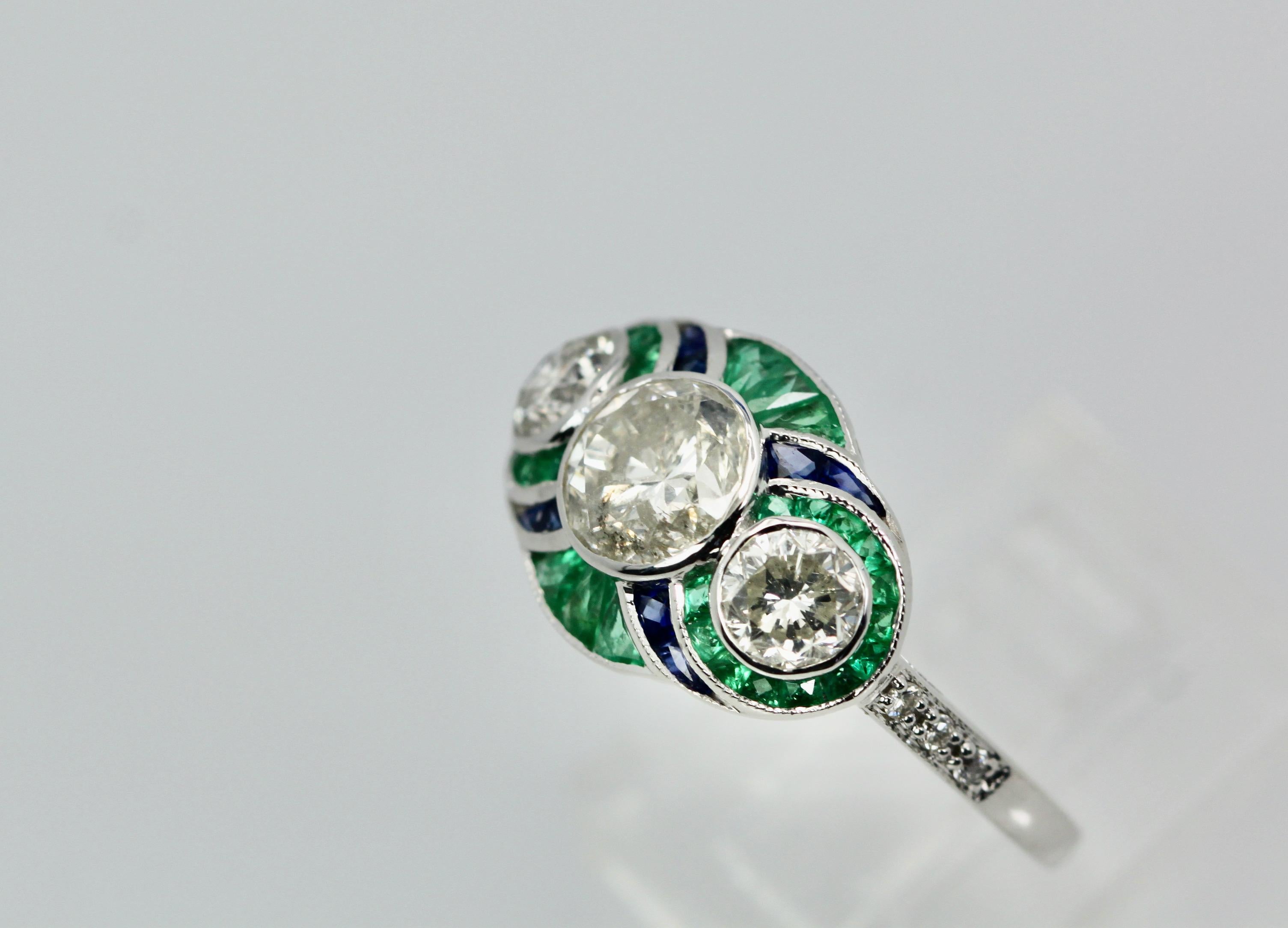 This gorgeous ring works beautifully with the Emerald earrings I just listed.  This ring weighs 4.7 Grams and it is 15.65mm in length and 11.24 mm in width and is a re-sizable 6.75.  This ring has a center stone of 1 carat and two side stones of .30