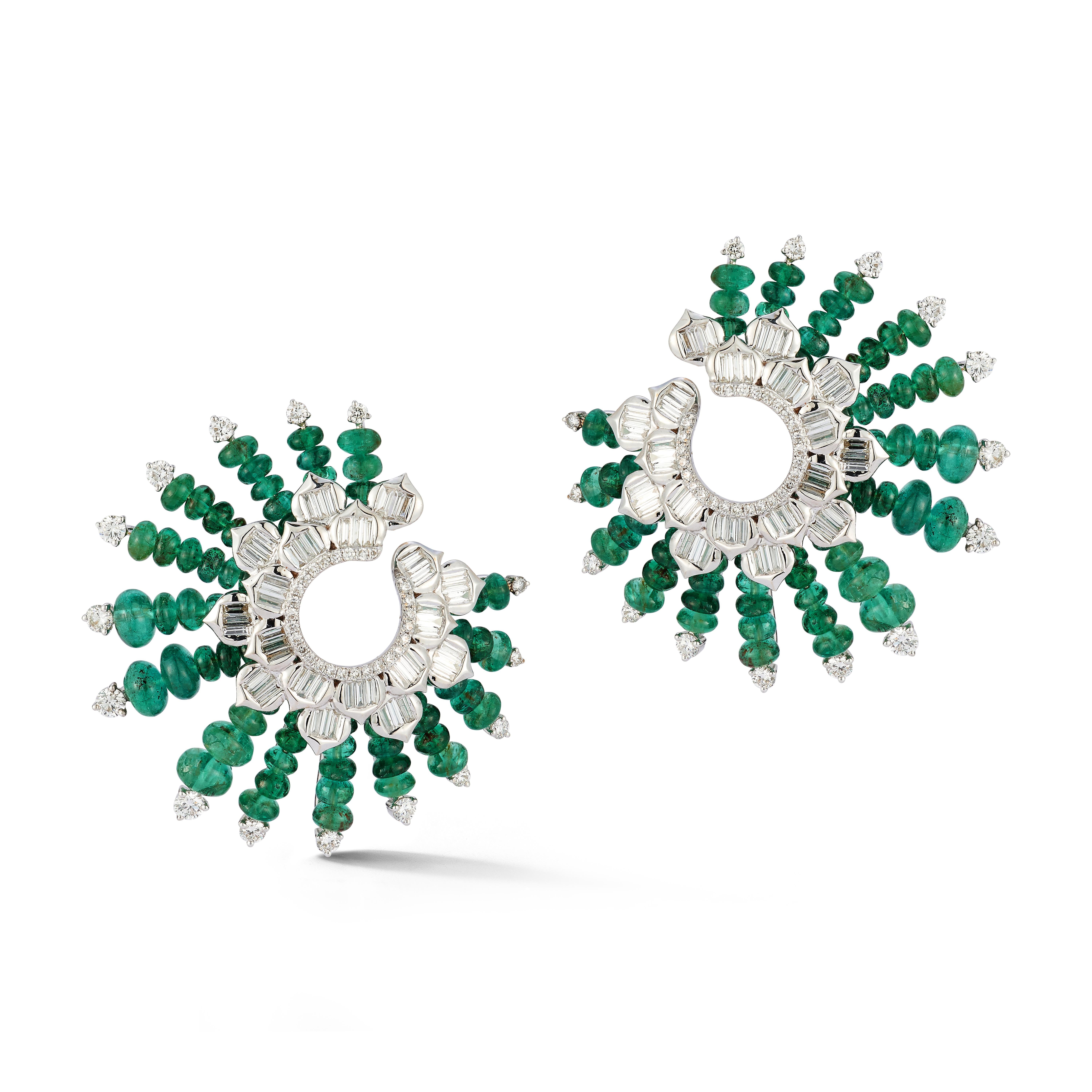 Emerald & Diamond Spiral Earrings

A pair of 18 karat white gold earrings set with round and baguette cut diamonds and emerald beads

Total Diamond Weight: 2.88 carats
Total Emerald Weight: 20.60 carats

Diameter: 1.5