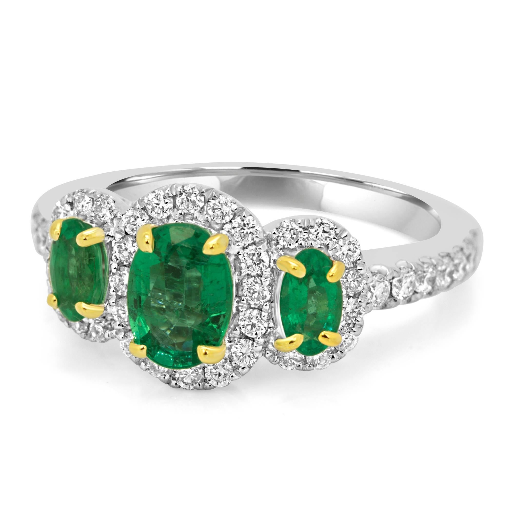 Stunning Three Stone Emerald Ring 1 Emerald Oval 0.90 Carat flanked with 2 Emerald Oval 0.45 Carat in a single Halo of White Round Diamonds 0.56 Carat in 14K White and Yellow Gold Fashion Cocktail Ring.

Style available in different price ranges.