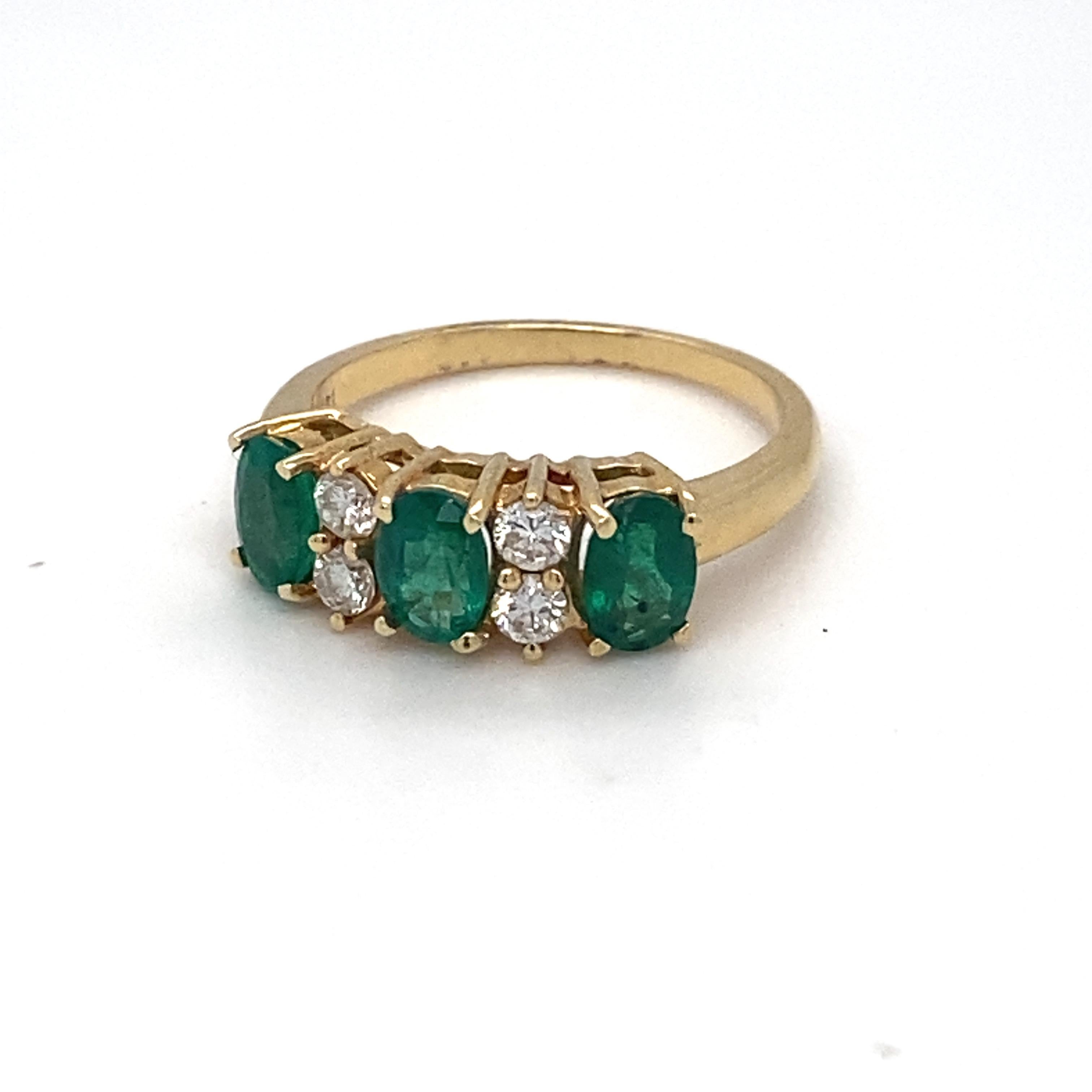 Oval Cut Emerald Diamond Three Stone Yellow Gold Ring For Sale
