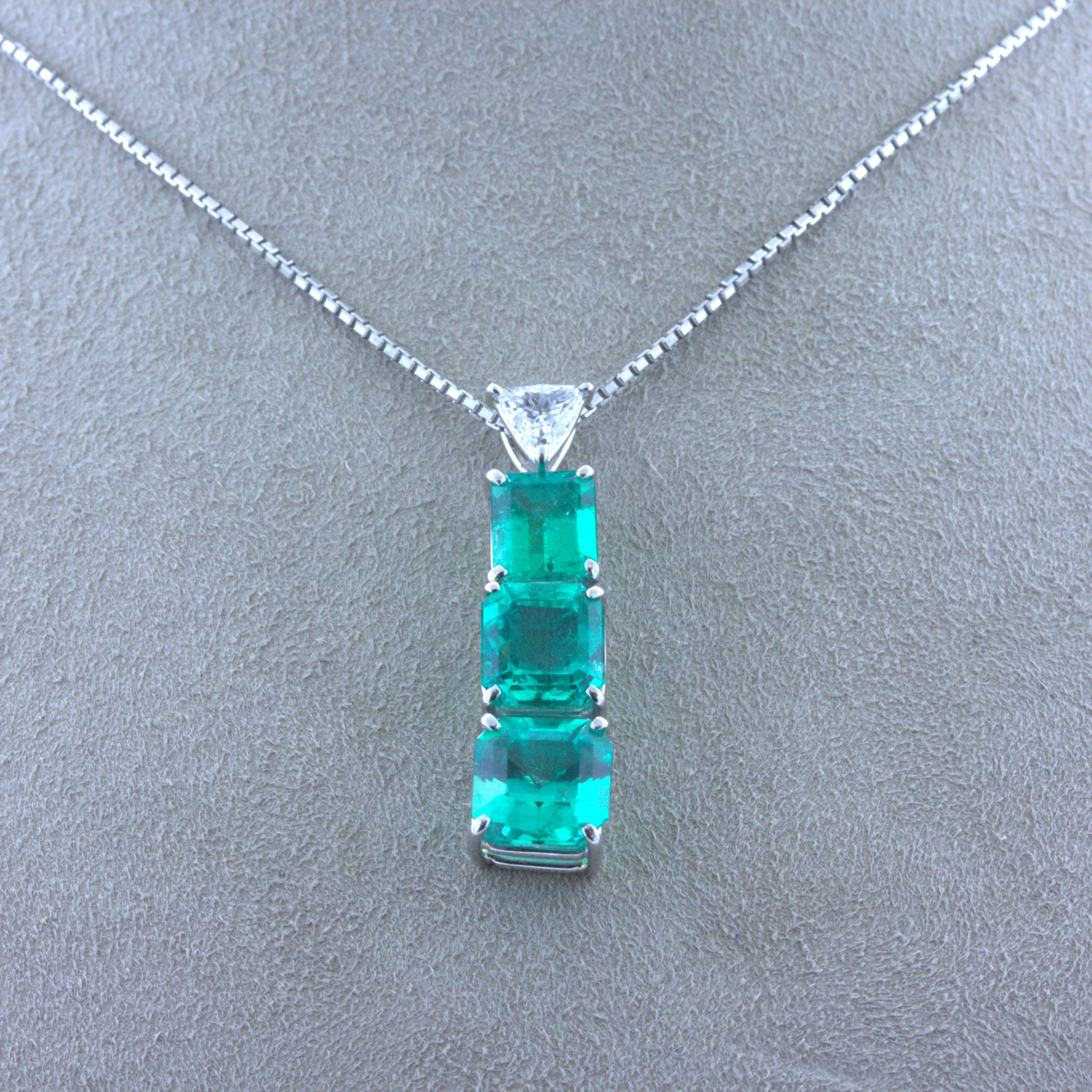 A very fine and unique pendant featuring 3 gem emeralds weighing a total of 4.15 carats. The emeralds have a rich and bright grass green color with excellent life and sparkle. They graduate in size and have a slight dangle and they are dropped from